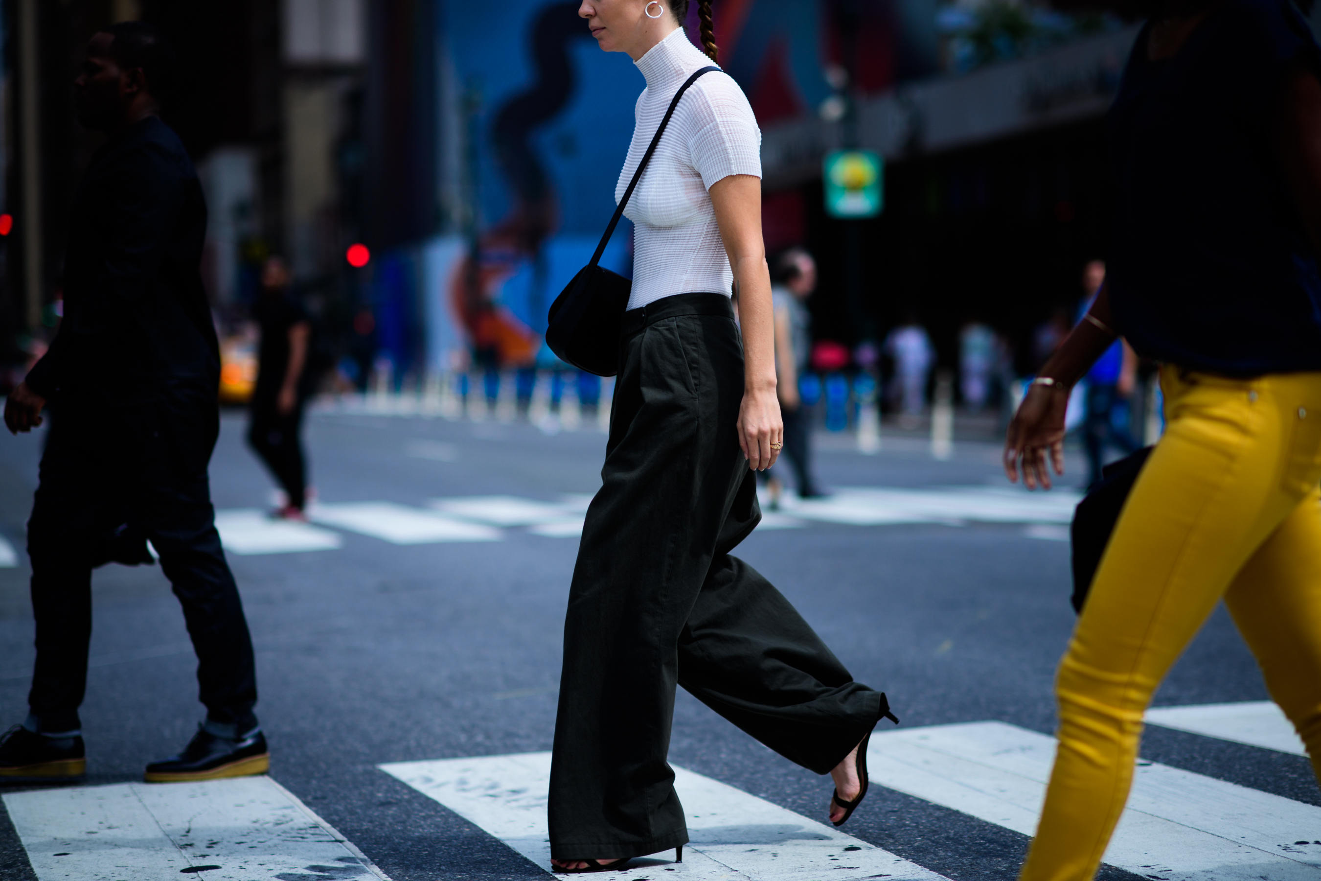 American stylist wearing green pants