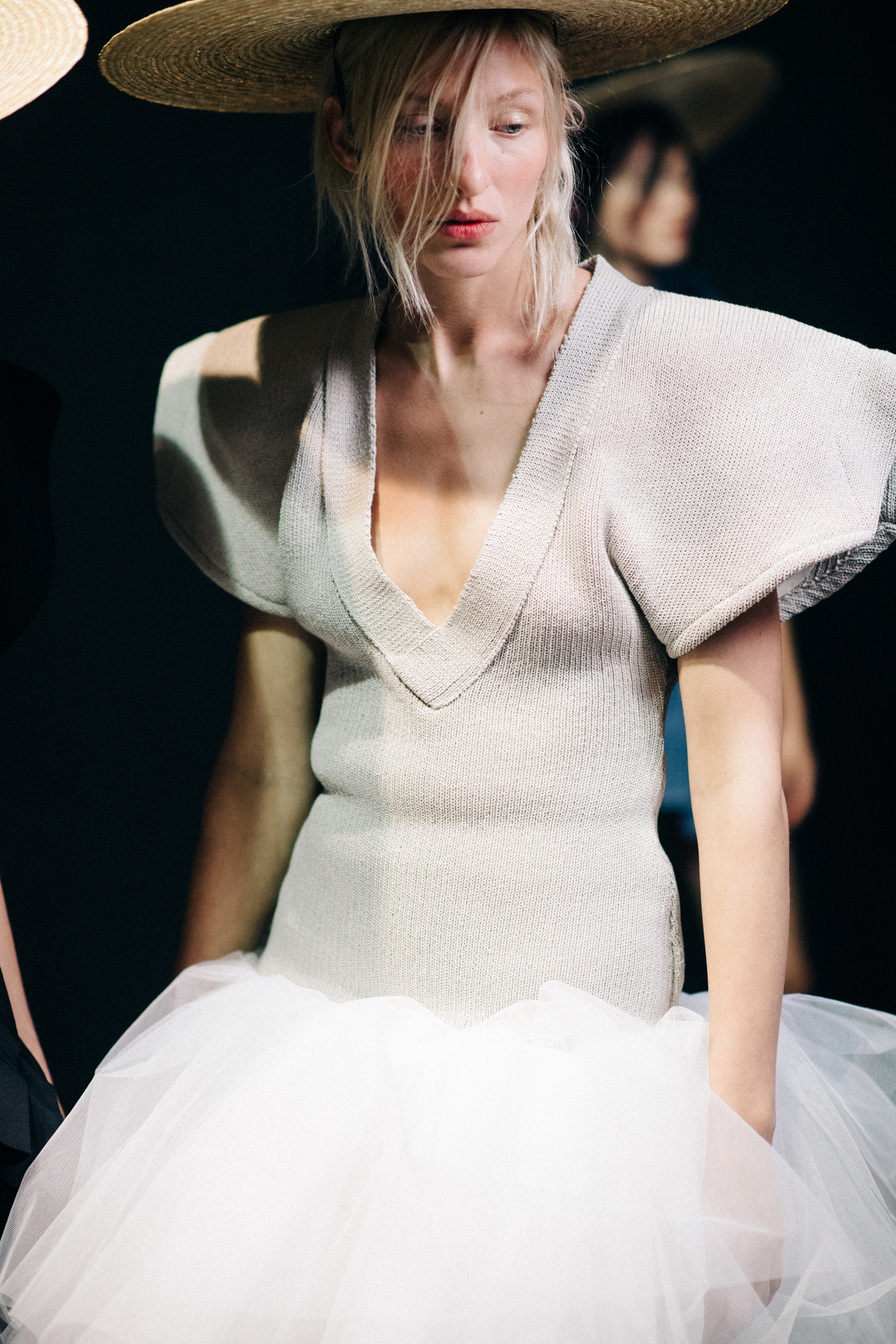 Model wearing white knit dress