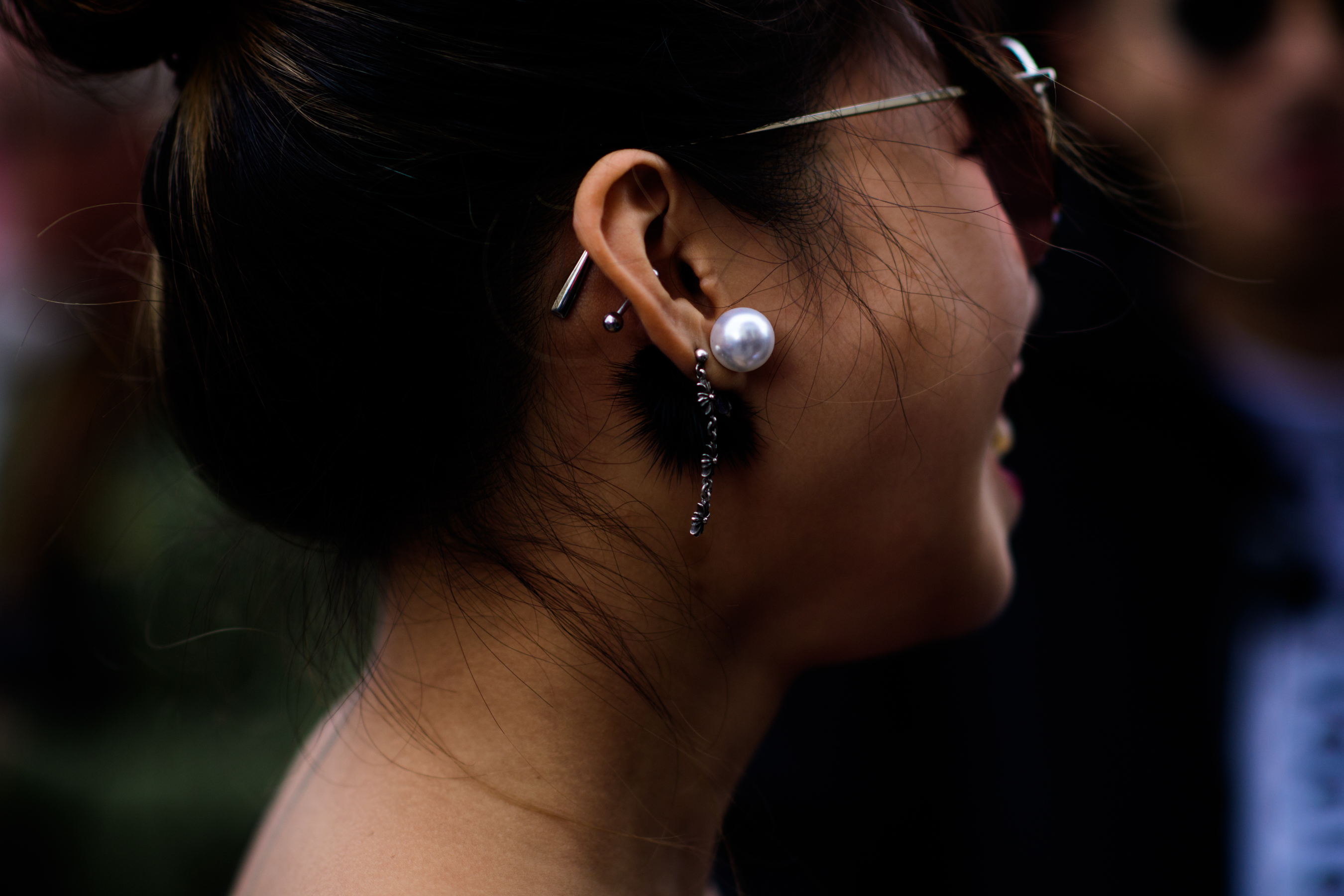 Woman wearing pearl earrings