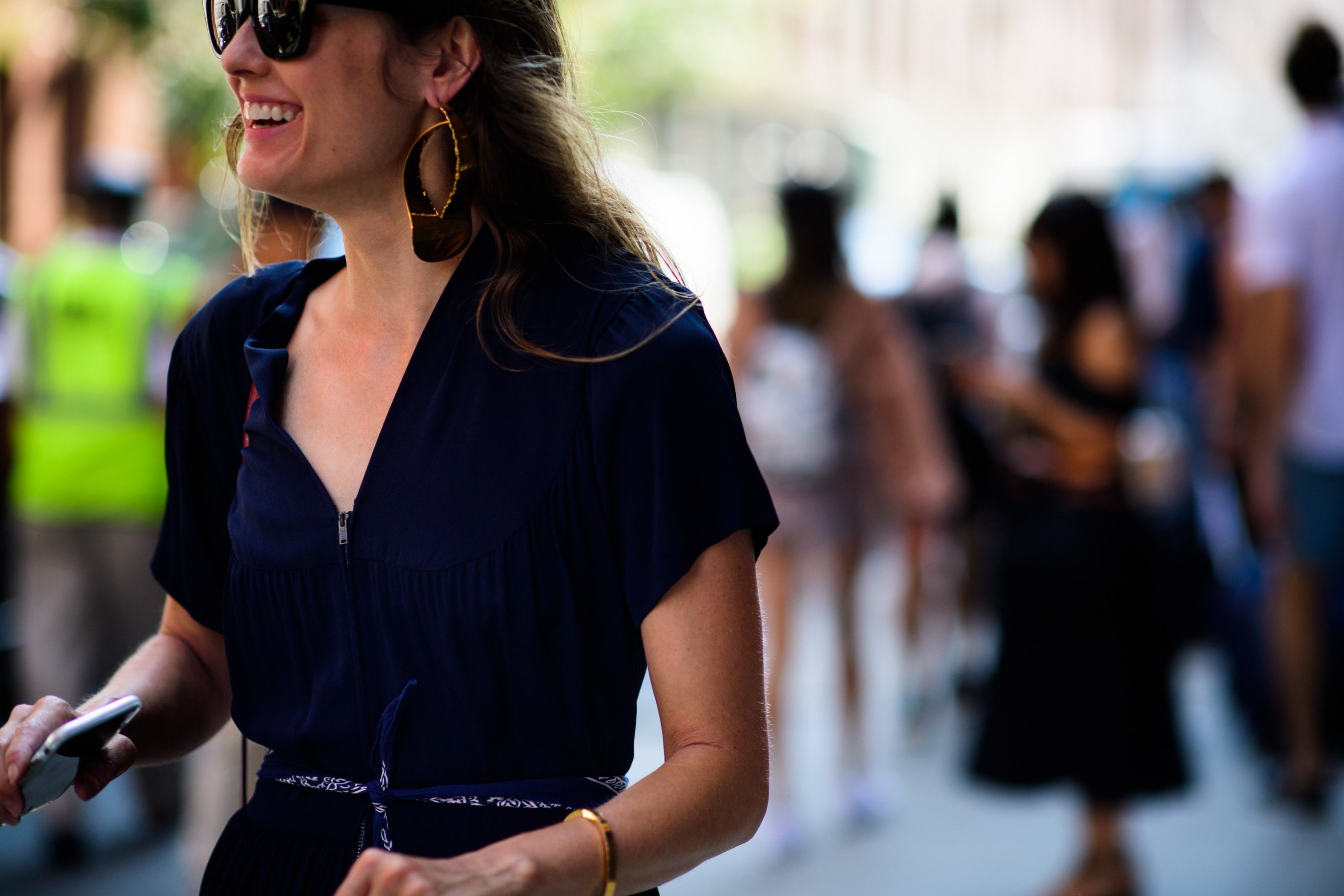 Woman wearing big golden earrings
