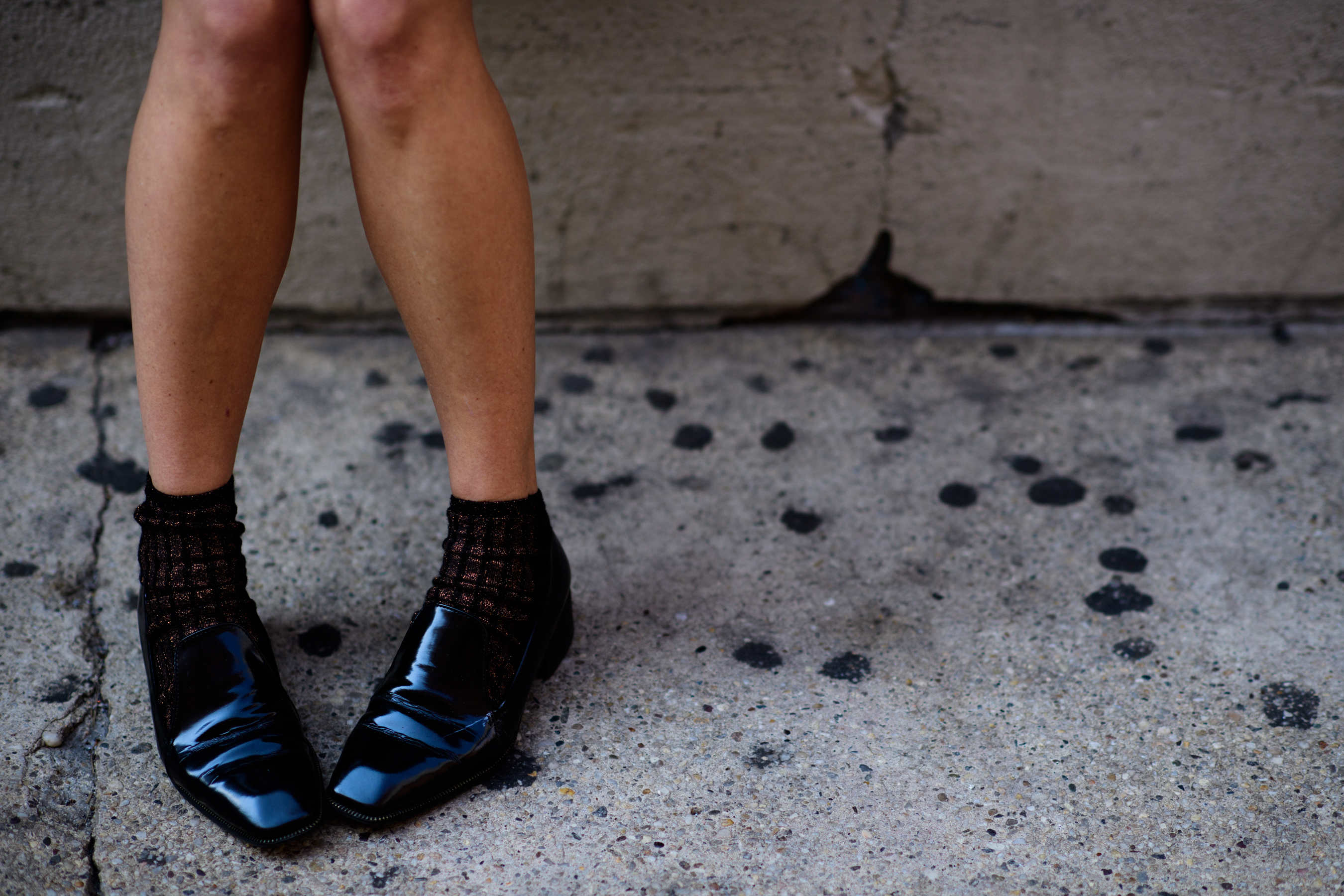 Woman wearing loafers and socks