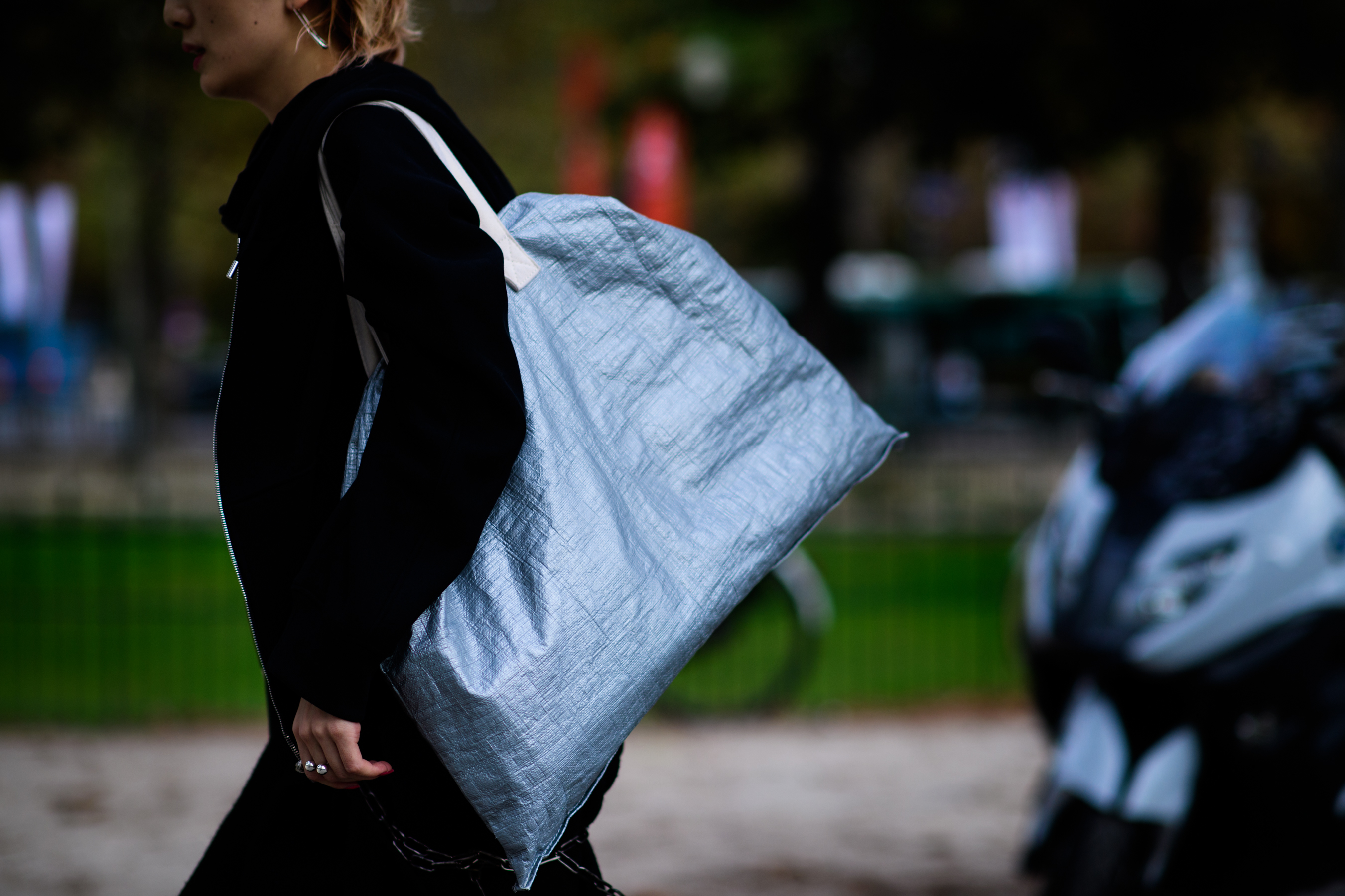 Woman with silver utility bag