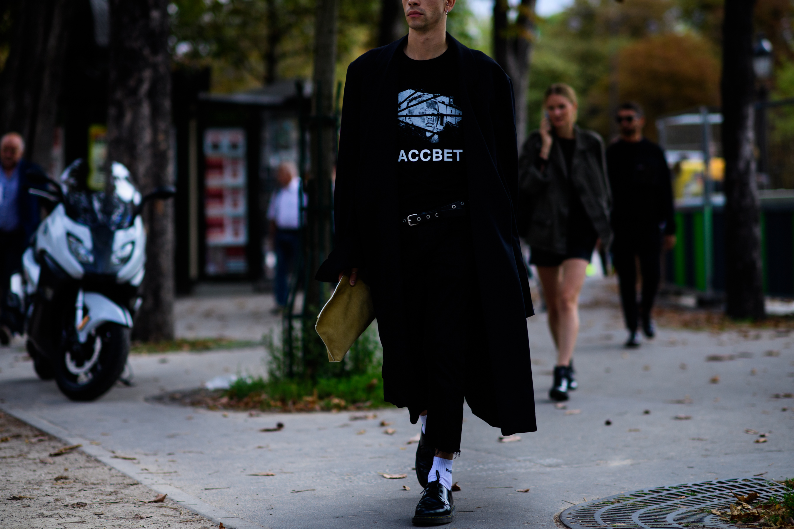 Man wearing black PACCBET t-shirt