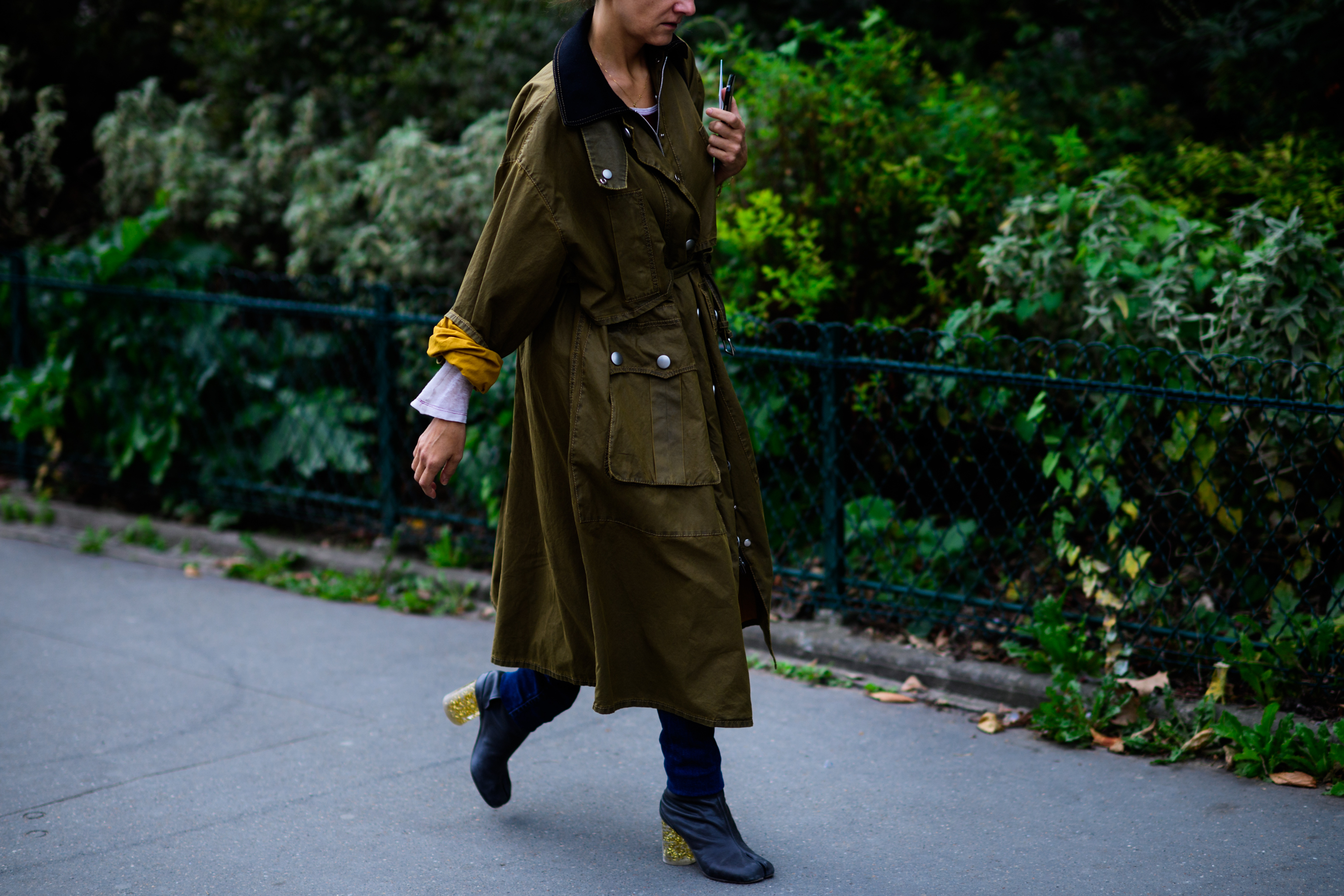 Woman wearing long green parka