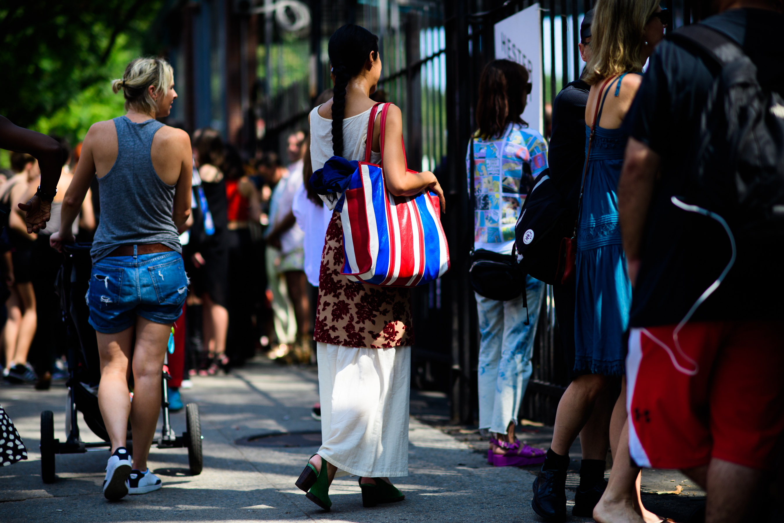 Woman with Balenciaga shopping bag