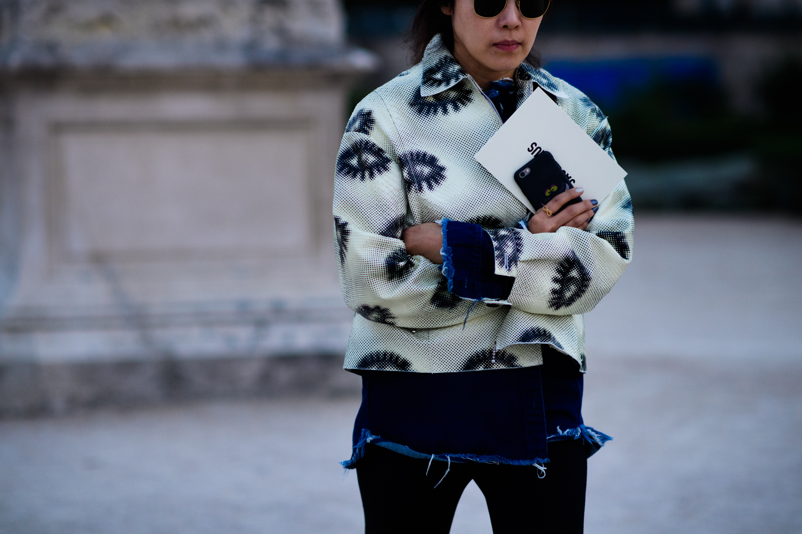 Woman wearing ripped denim jacket