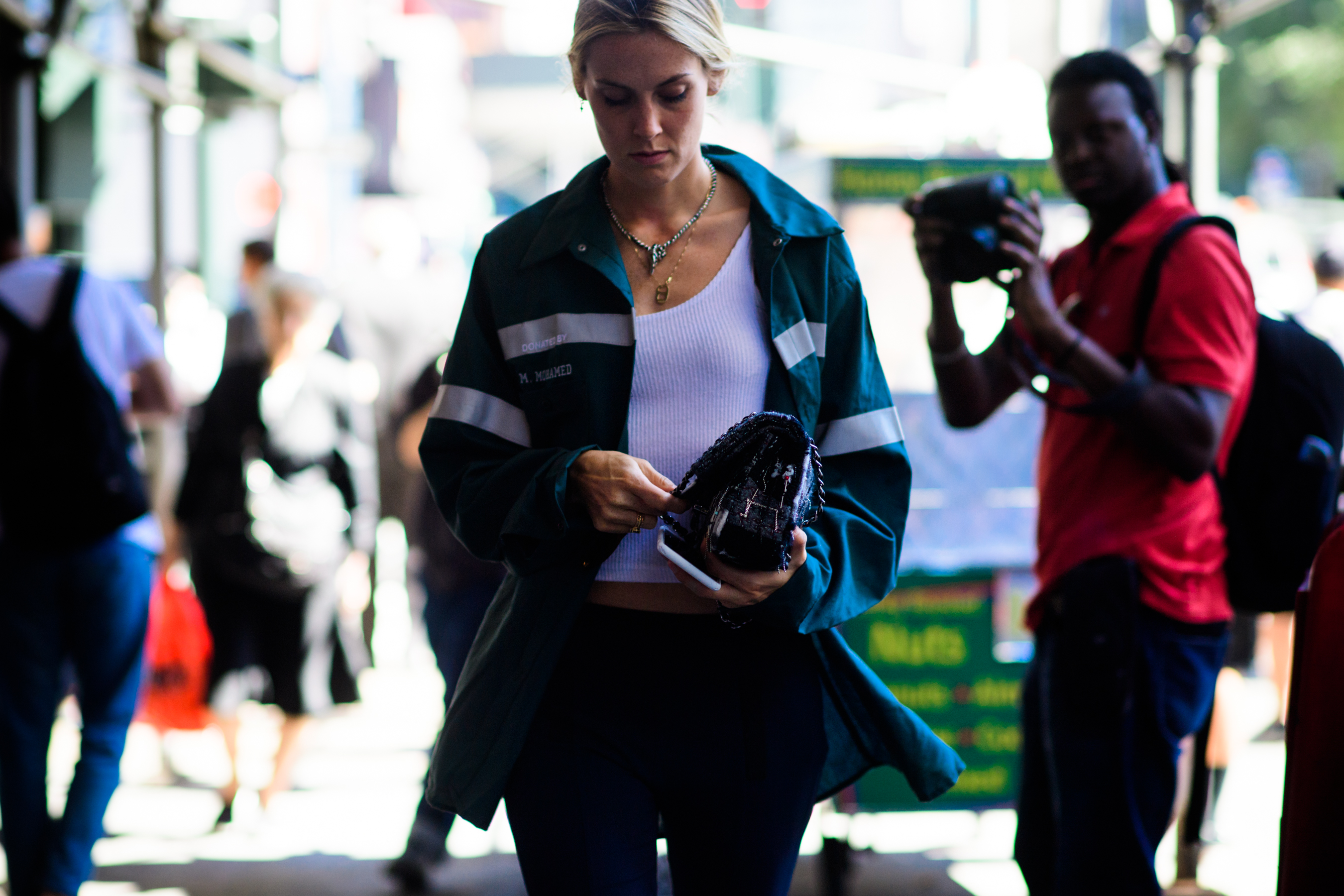 Woman wearing Heron Preston DSNY jacket