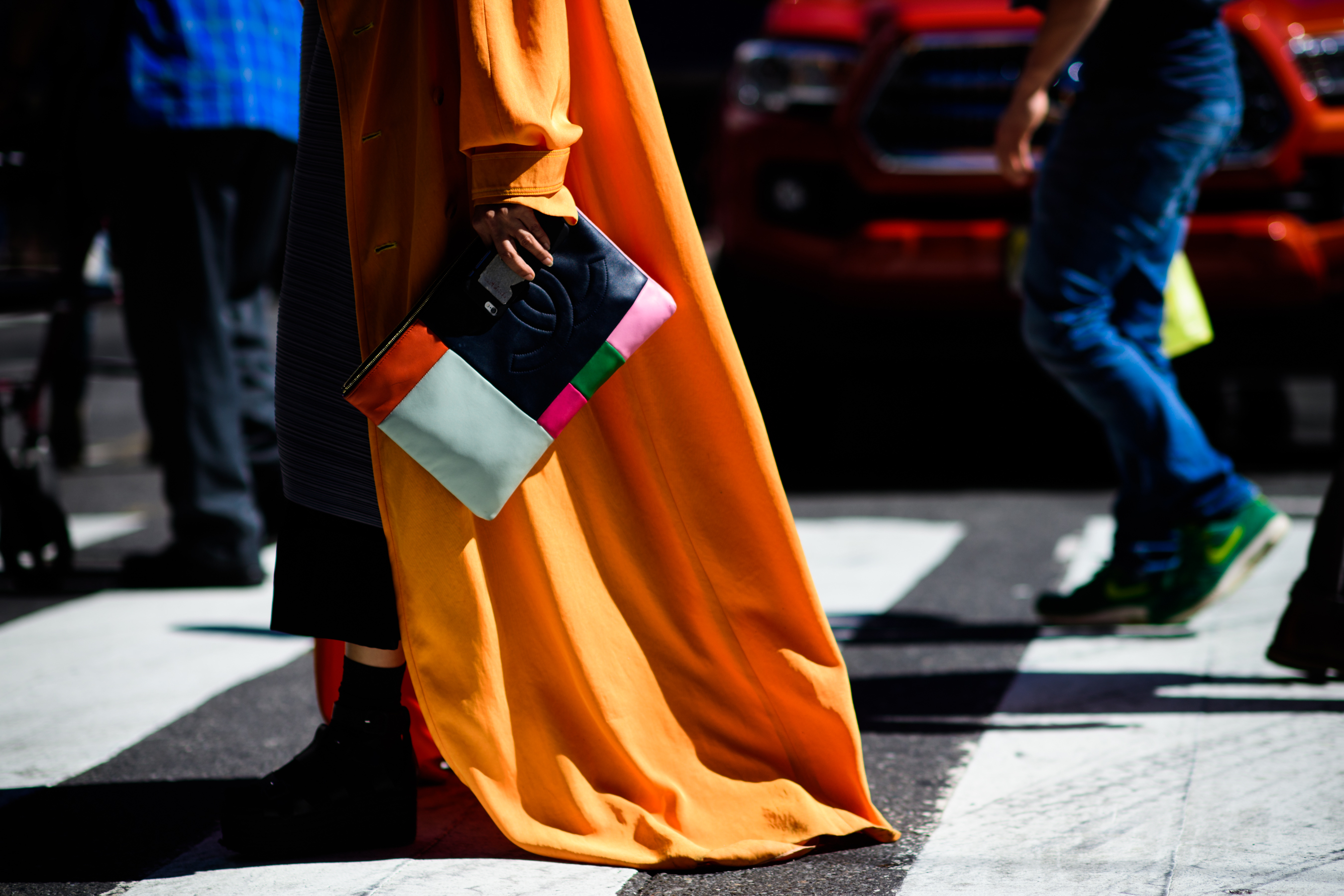 Woman wearing long orange cape