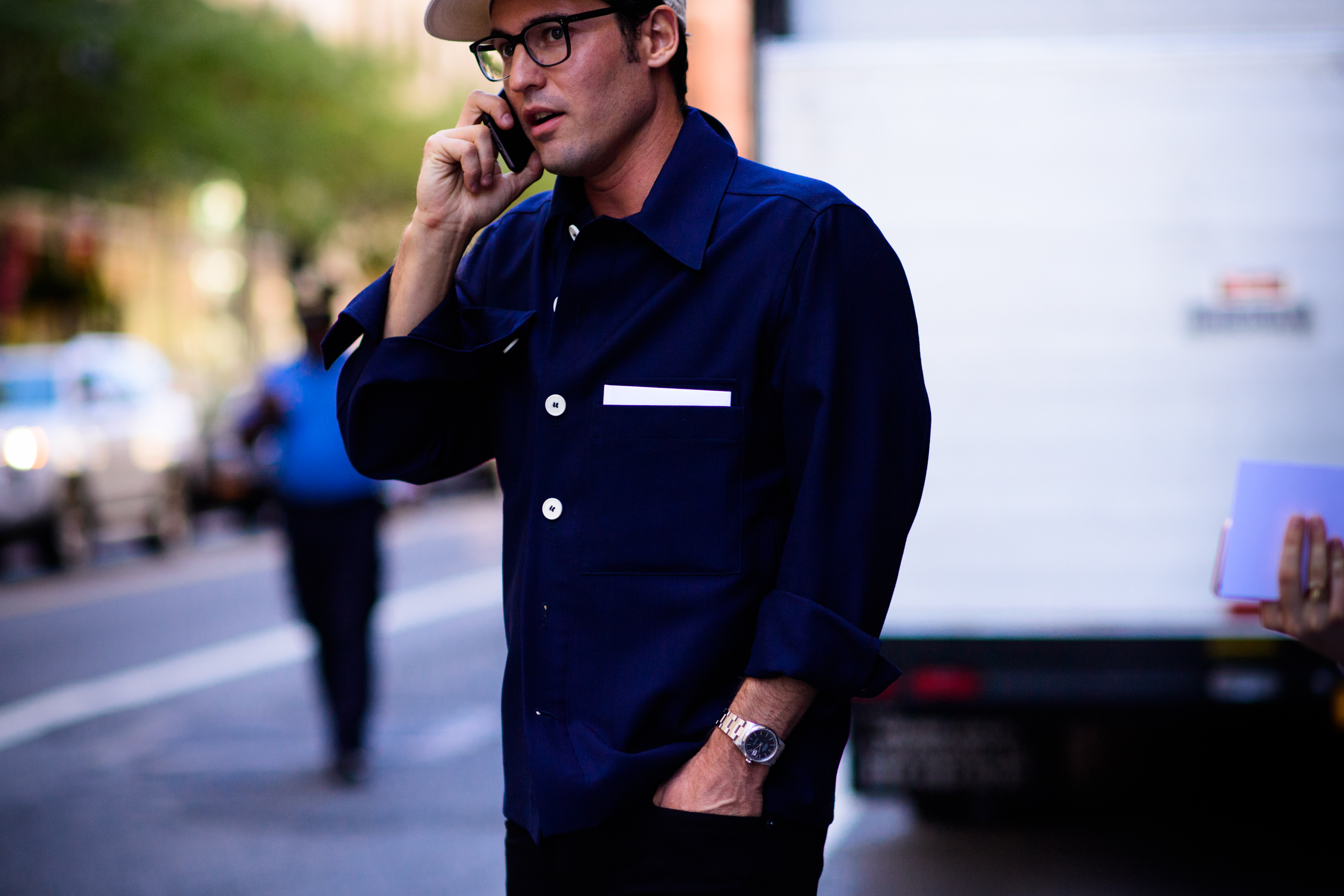 Man wearing blue shirt and glasses