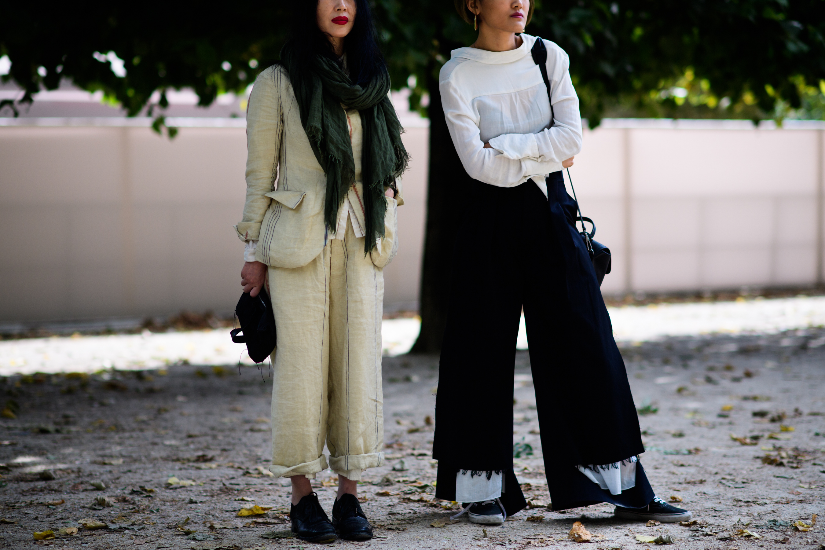 Two women wearing vintage outfits