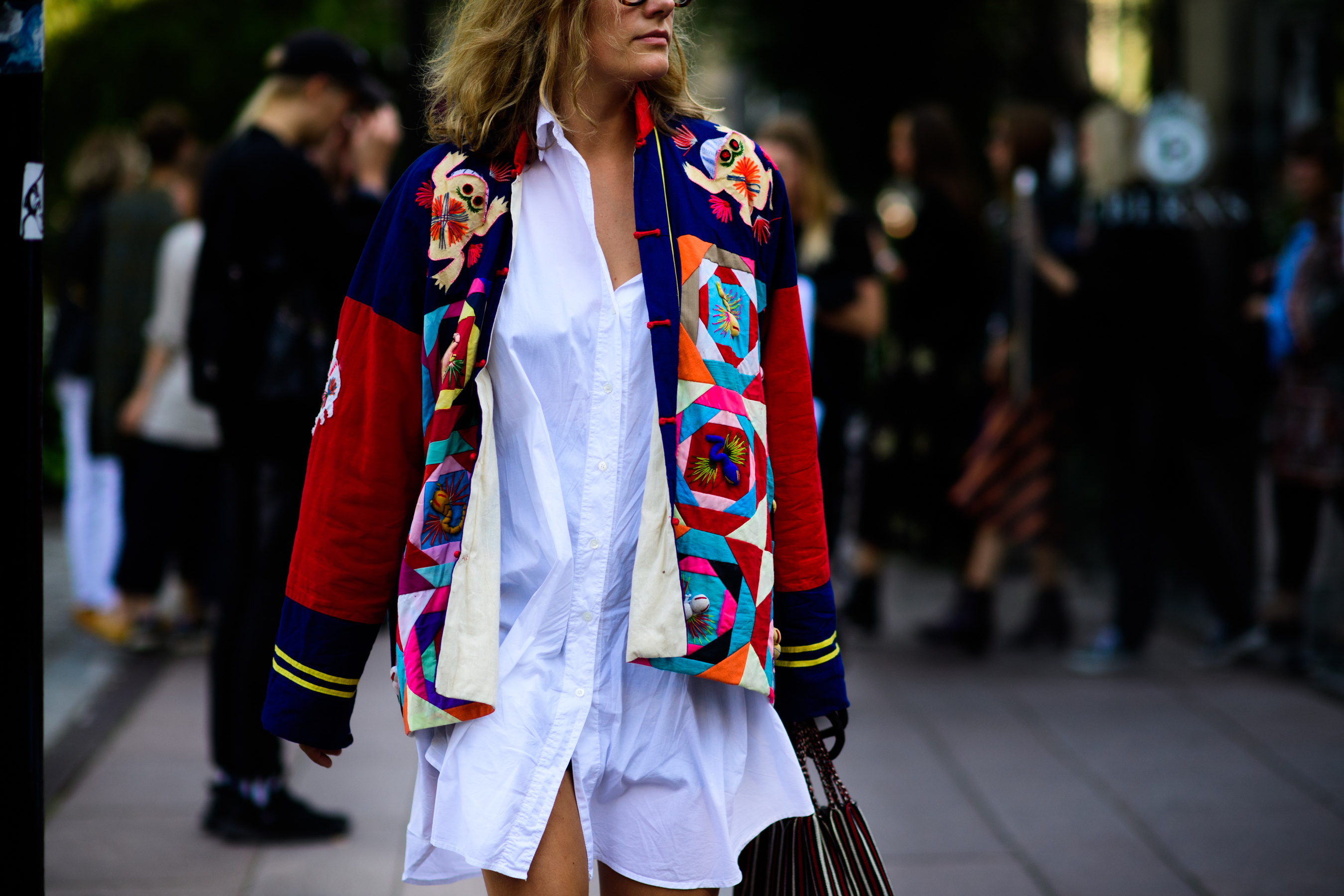 Woman wearing multicolored jacket