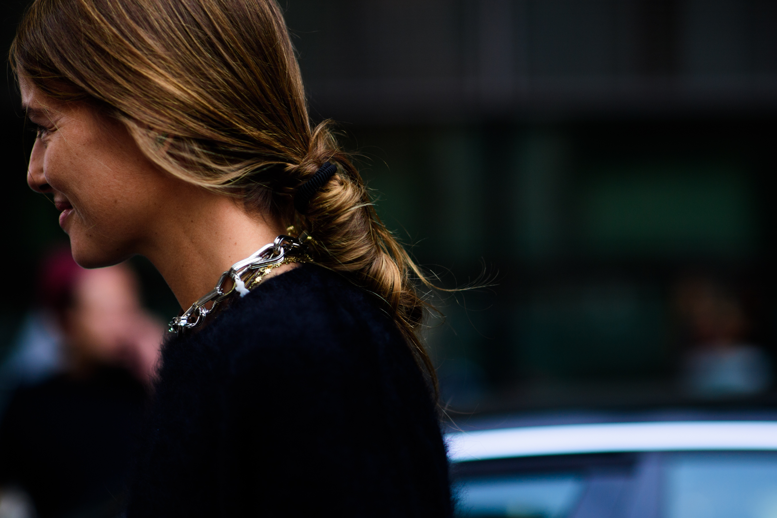 Italian woman wearing metal necklace