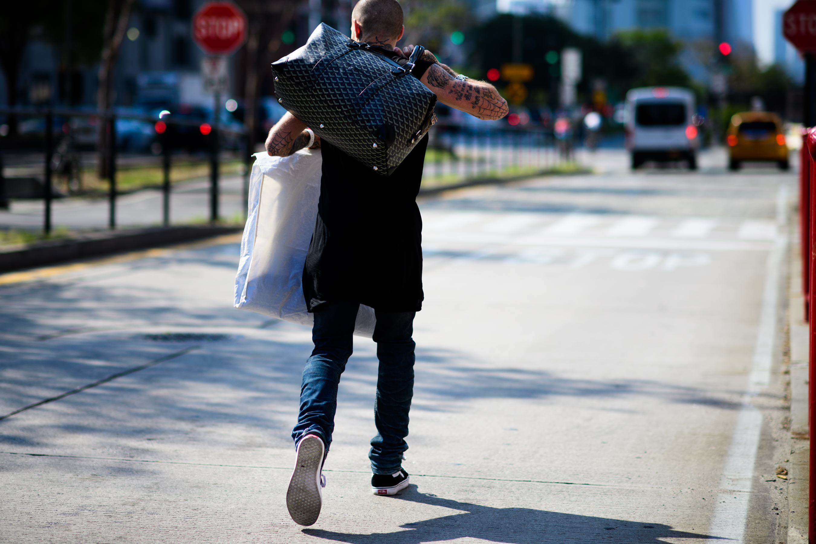 American man holding big bag
