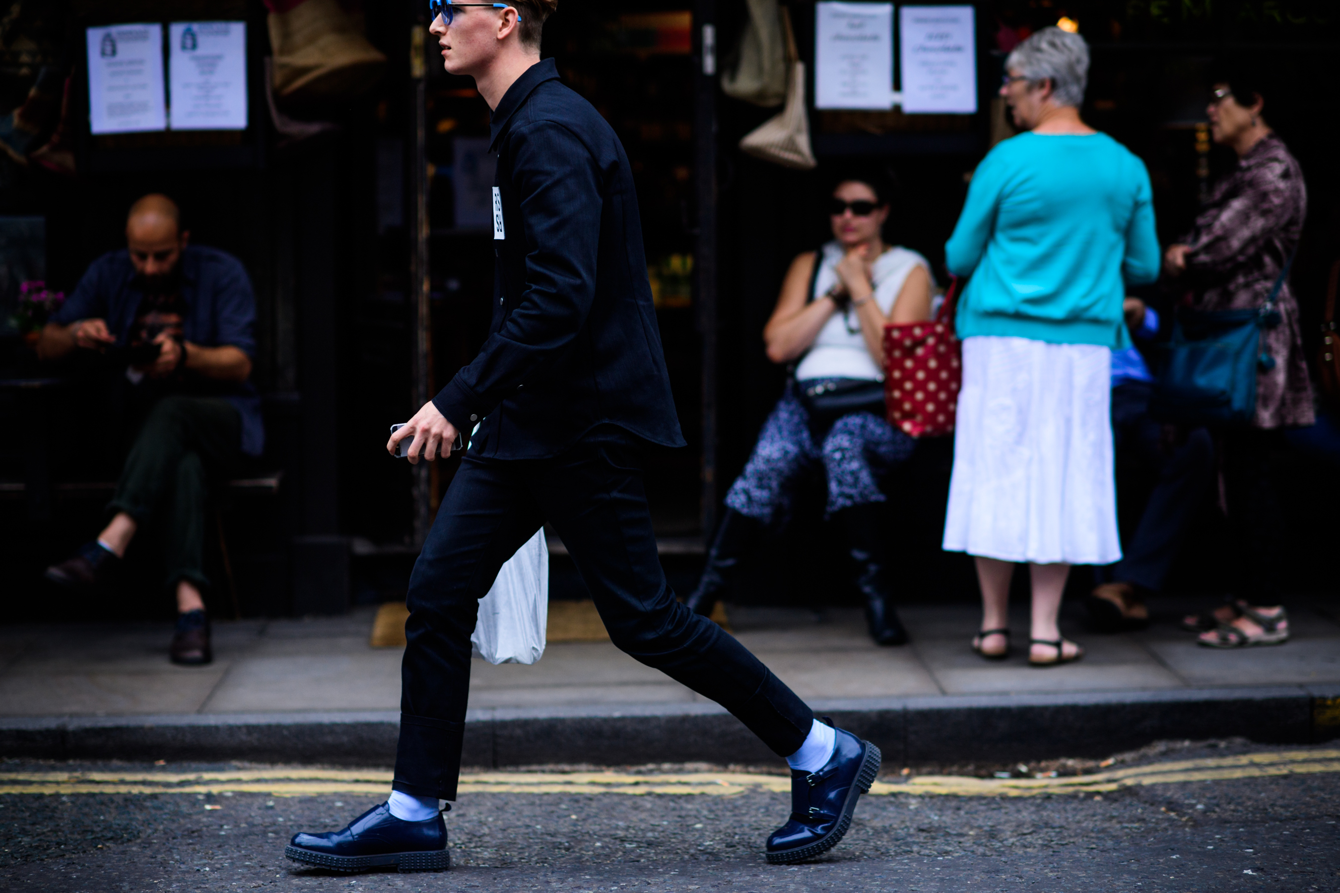 Man wearing Raf Simons black shirt