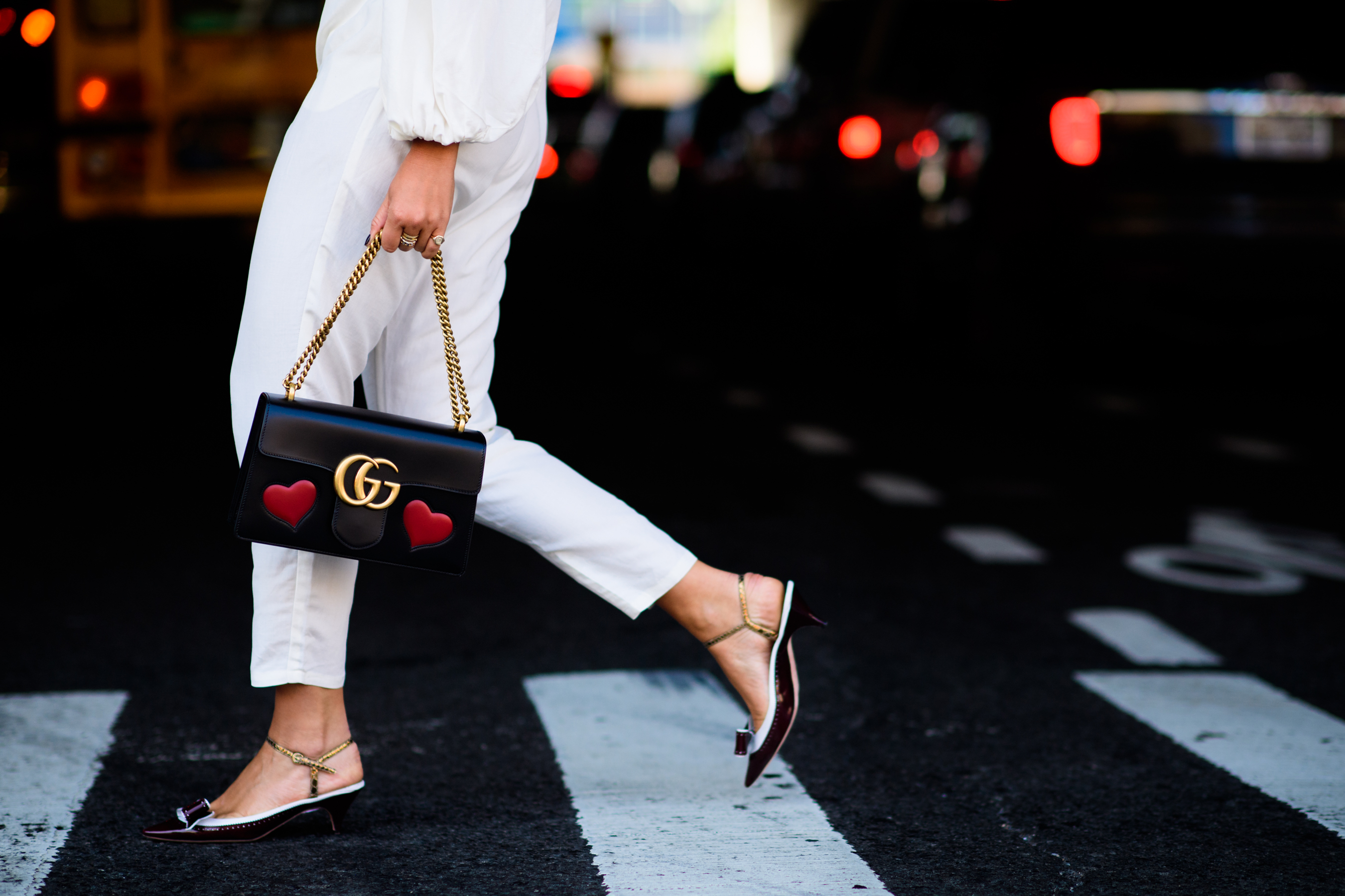 Blogger wearing white and Gucci bag