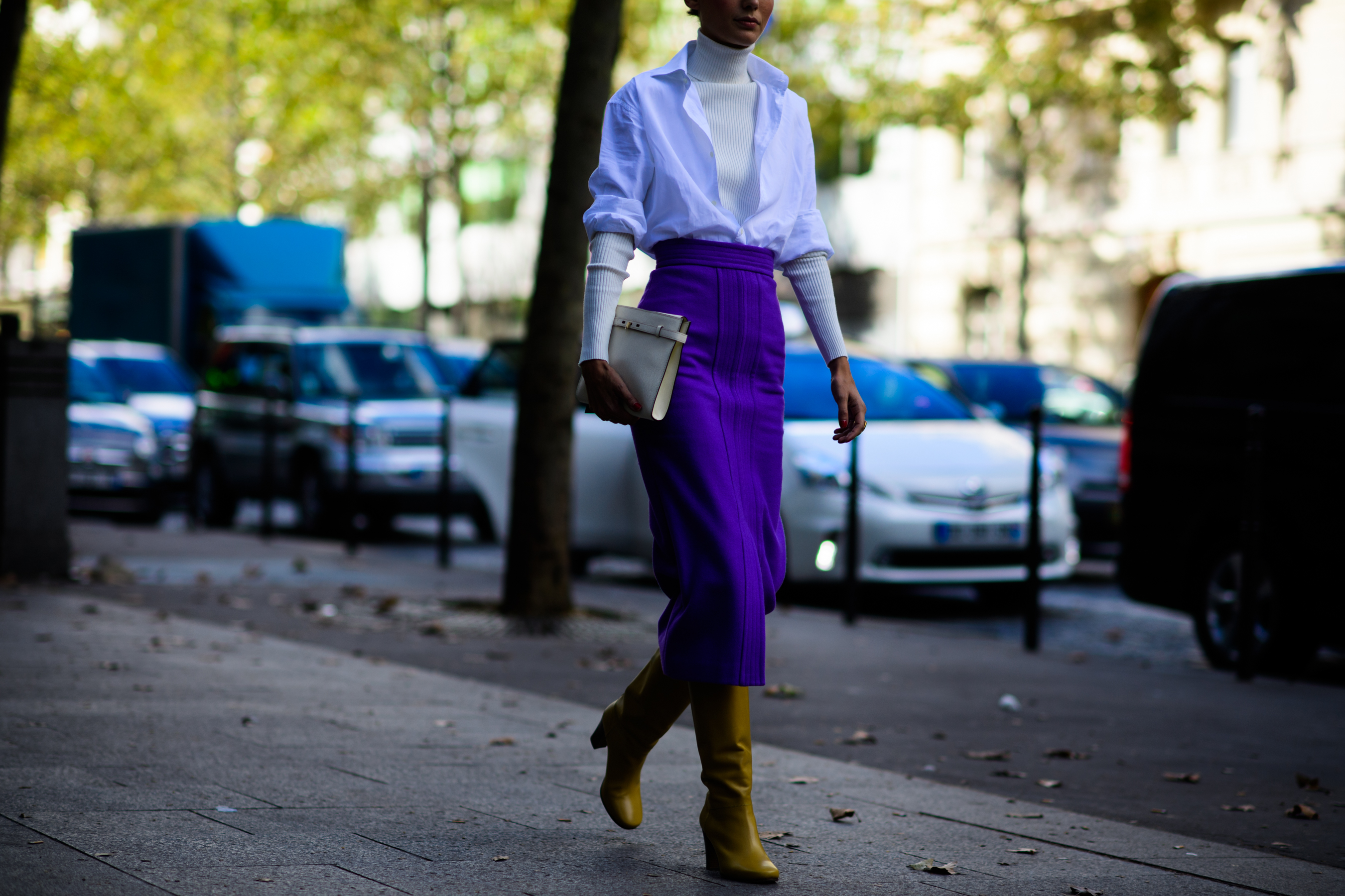 Italian stylist wearing purple skirt