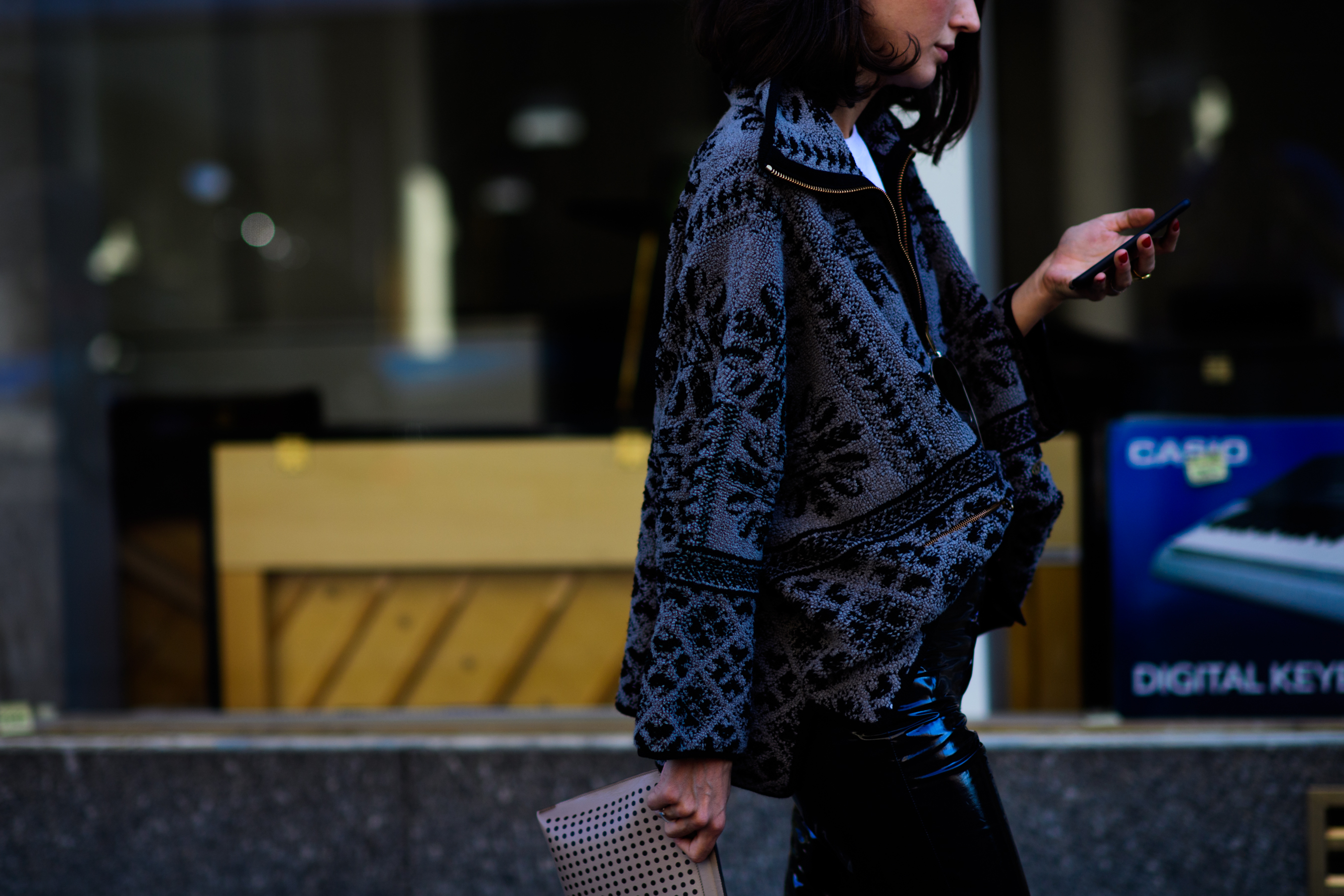 Italian stylist wearing grey jacket