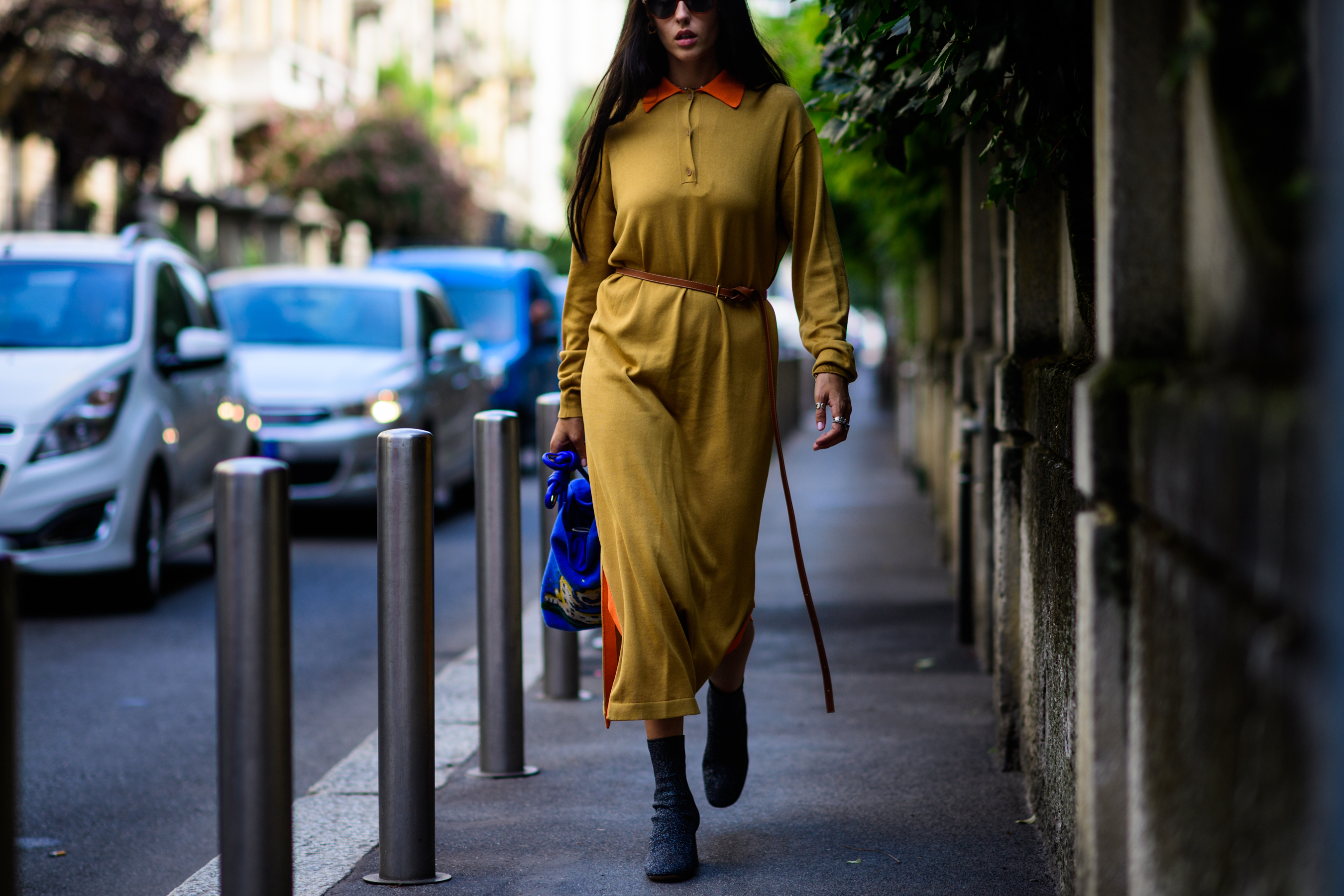 Italian designer wearing mustard dress