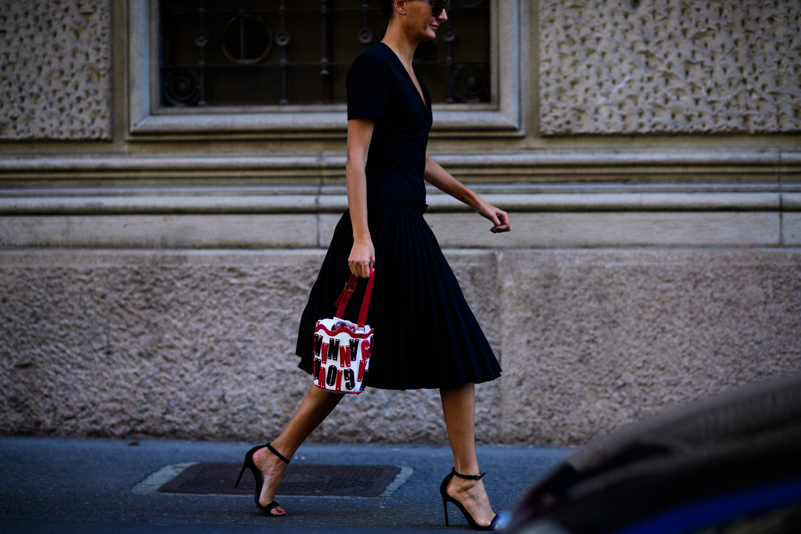 Italian stylist wearing black dress