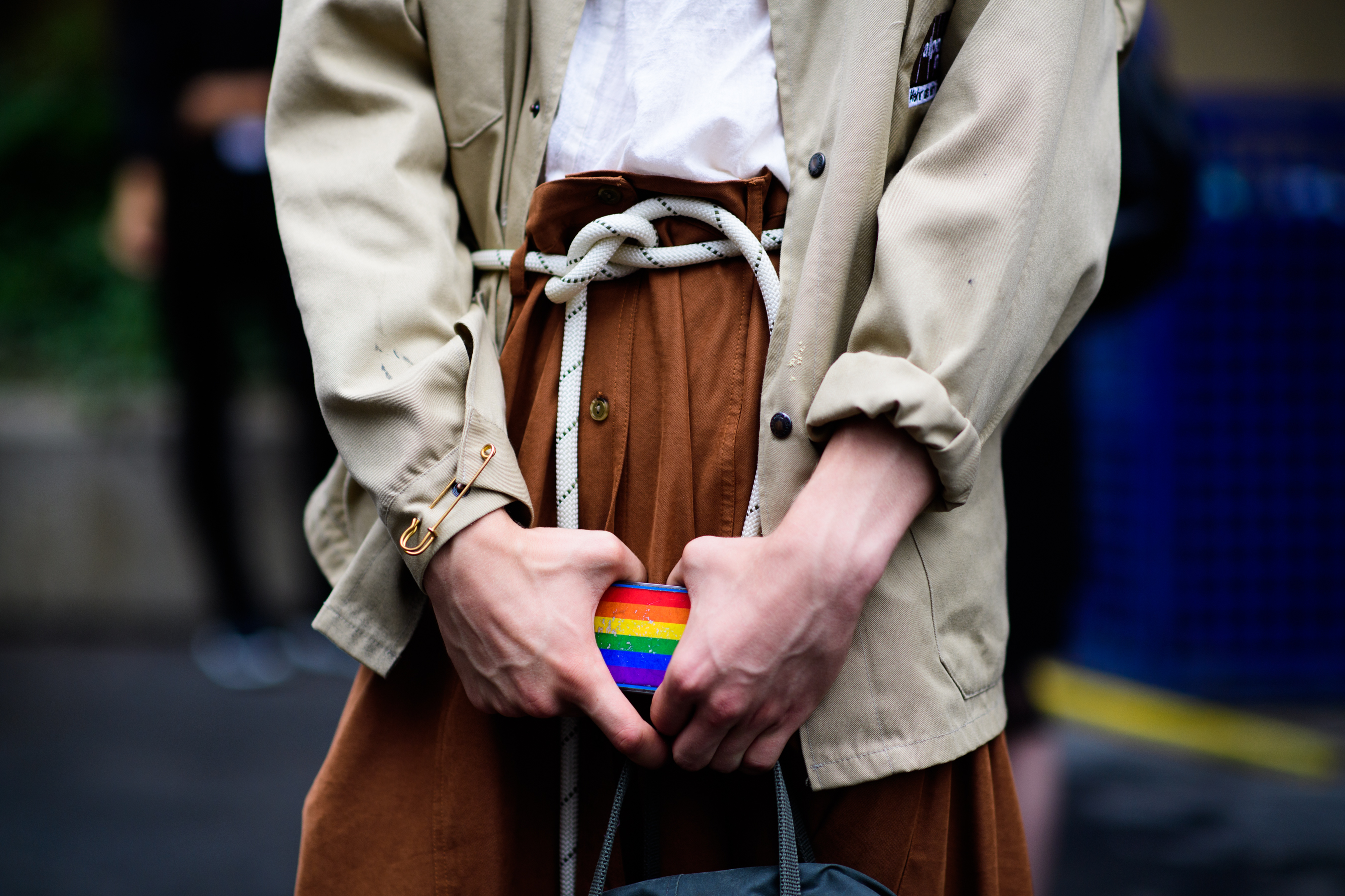 Man holding rainbow phone case