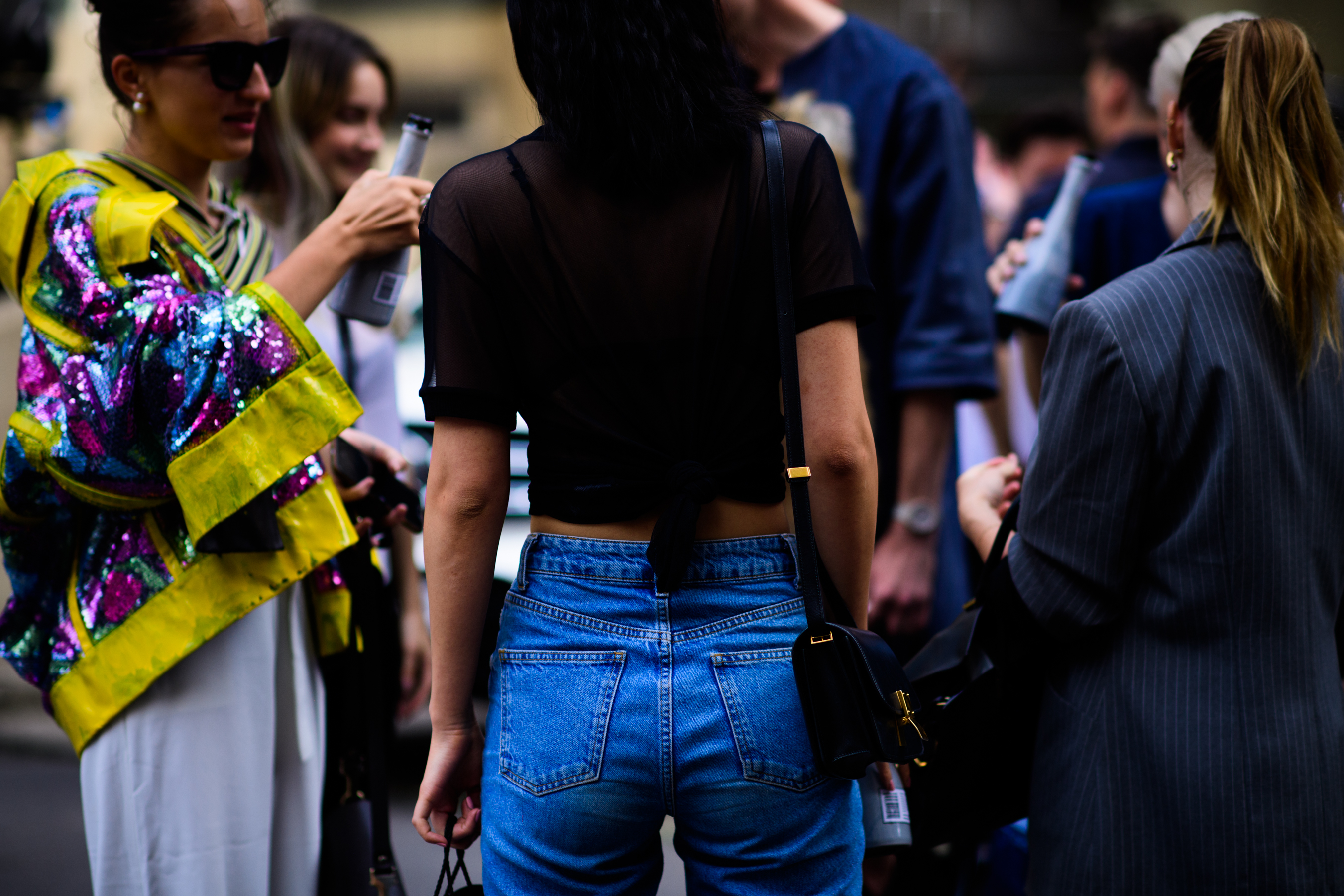 Woman wearing crop top and denim