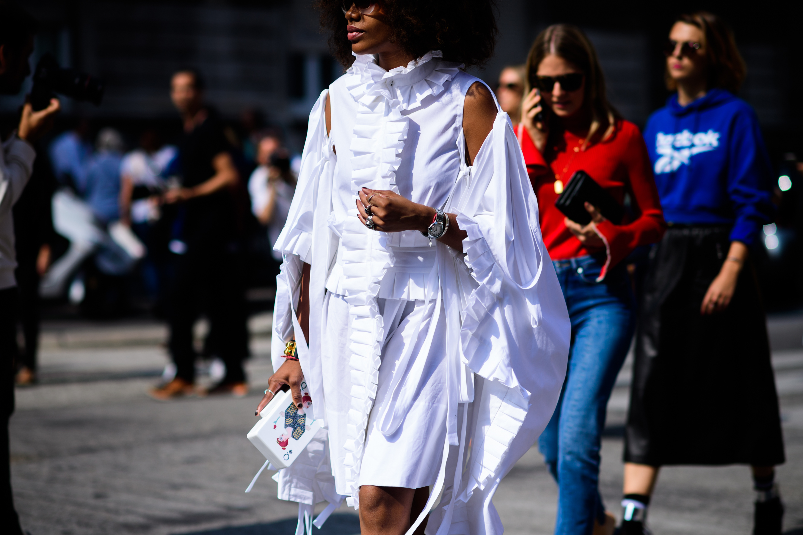 Woman wearing white shirt dress