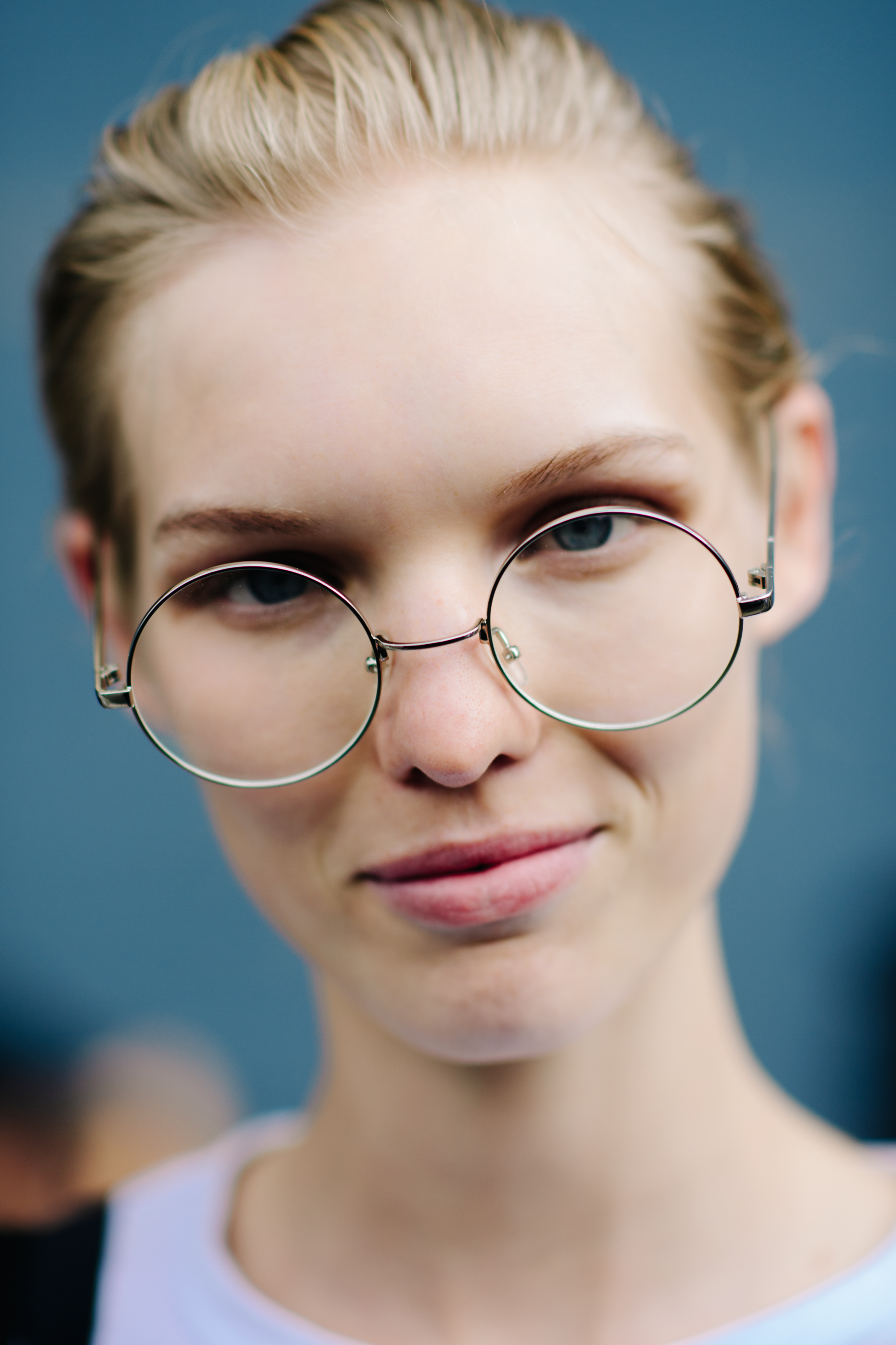 Portrait of a model wearing rounded glasses