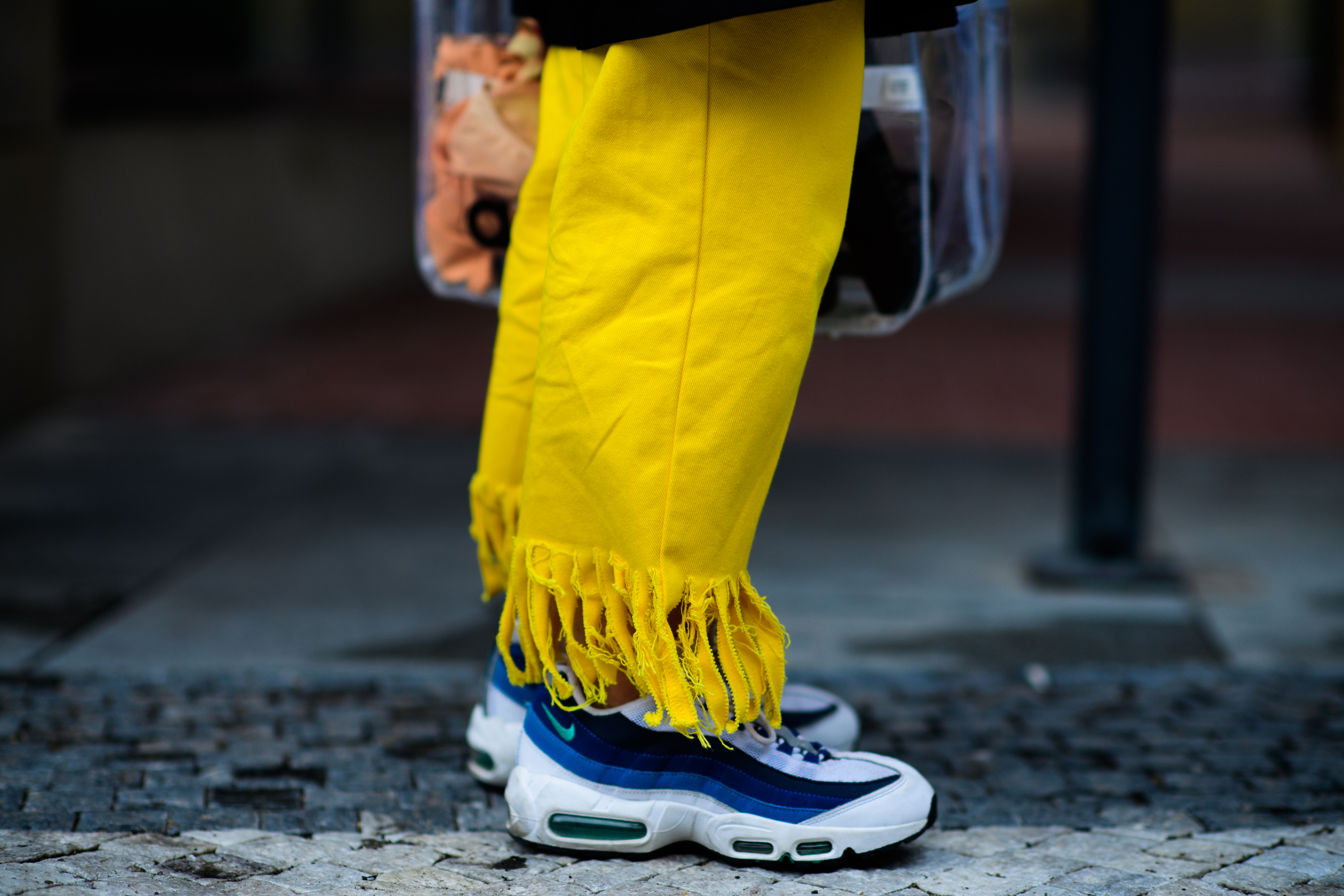 Woman wearing yellow ruffled jeans