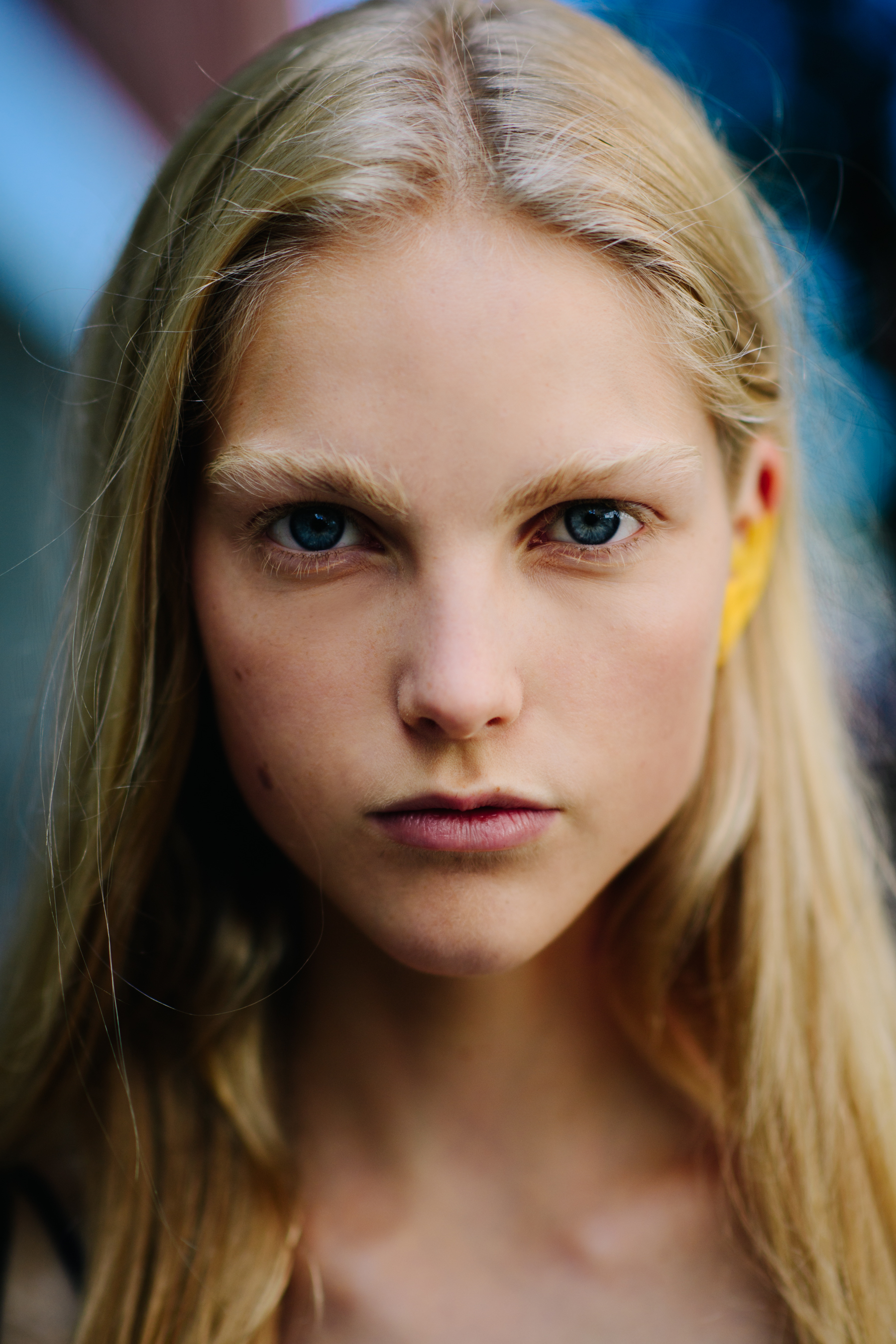 Portrait of a model with yellow ear