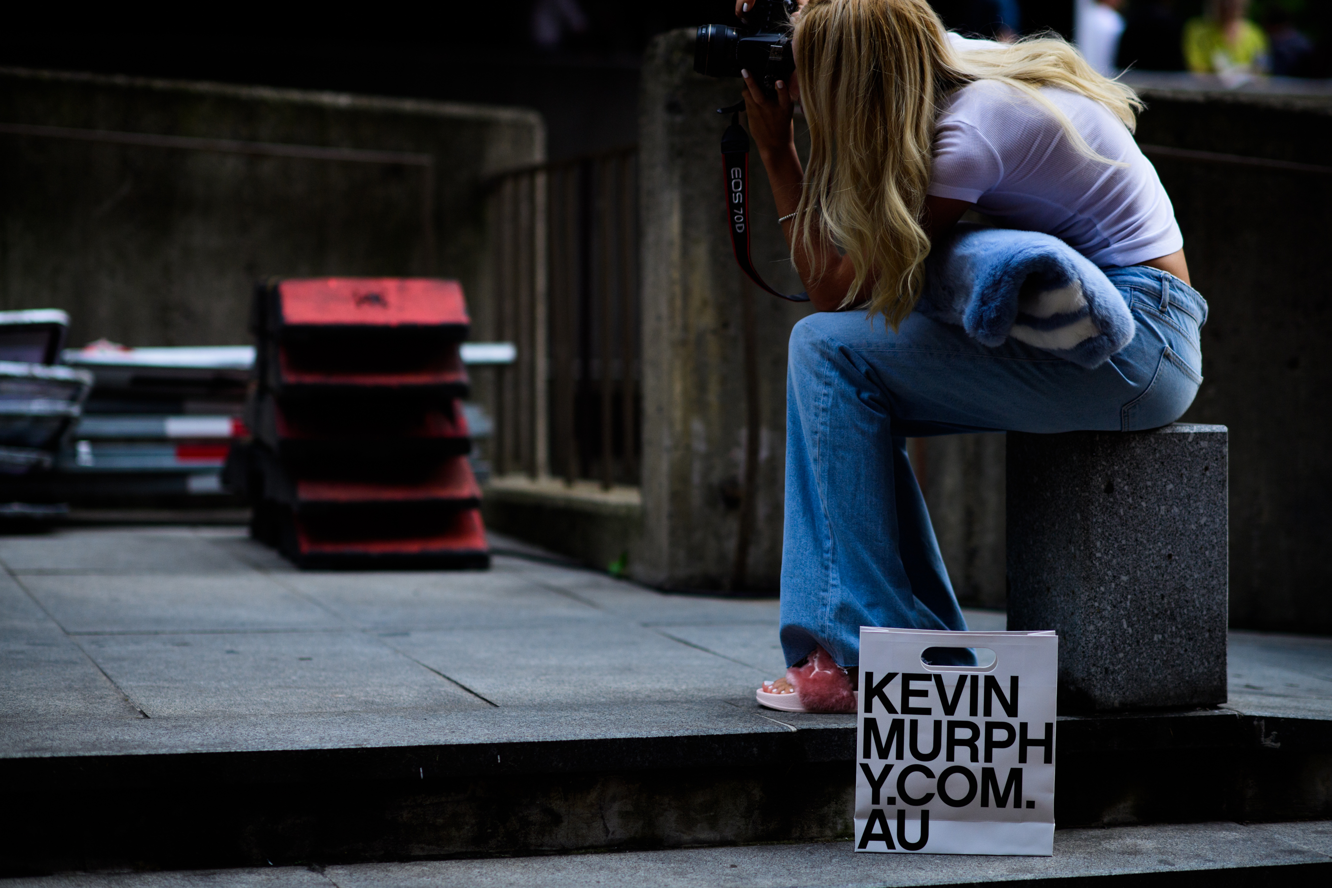 Photographer wearing wide denim pants