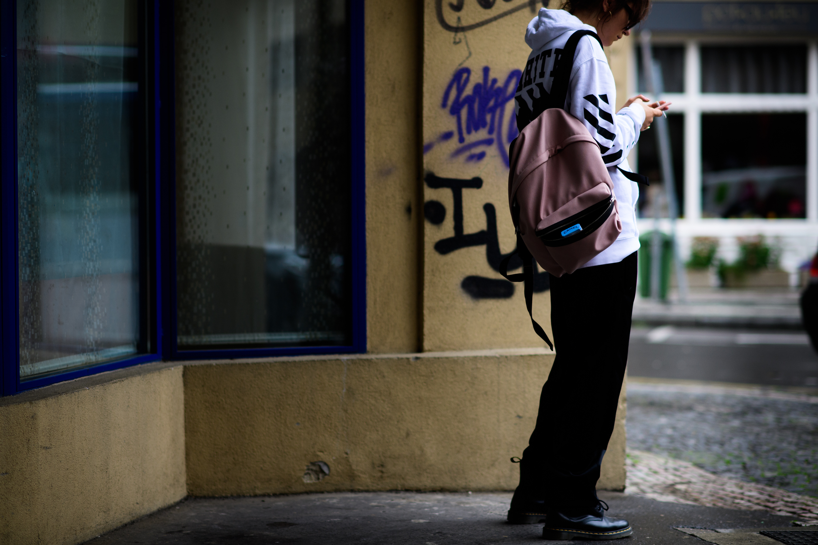 Woman wearing Off-White hoodie