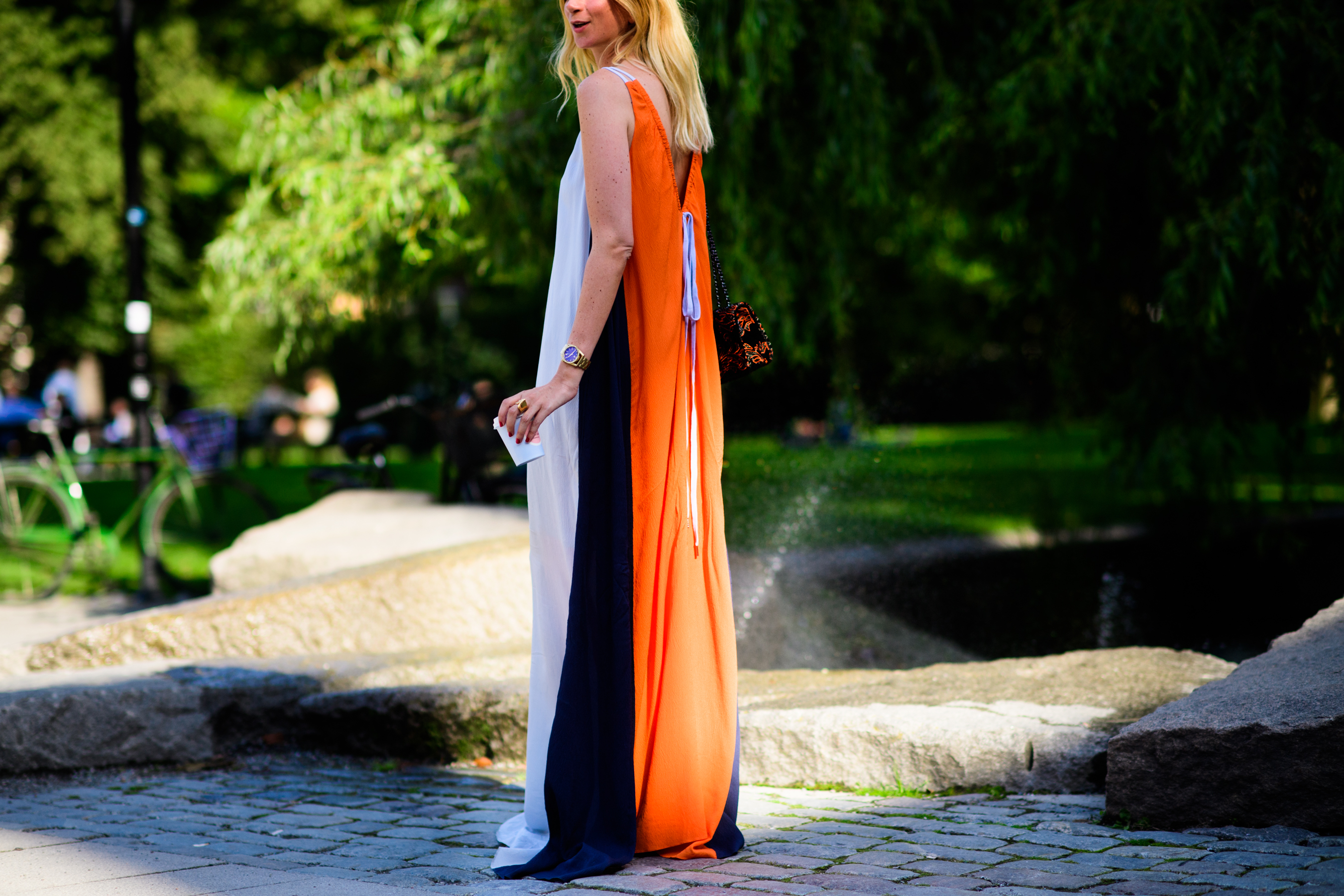 French woman wearing long orange dress