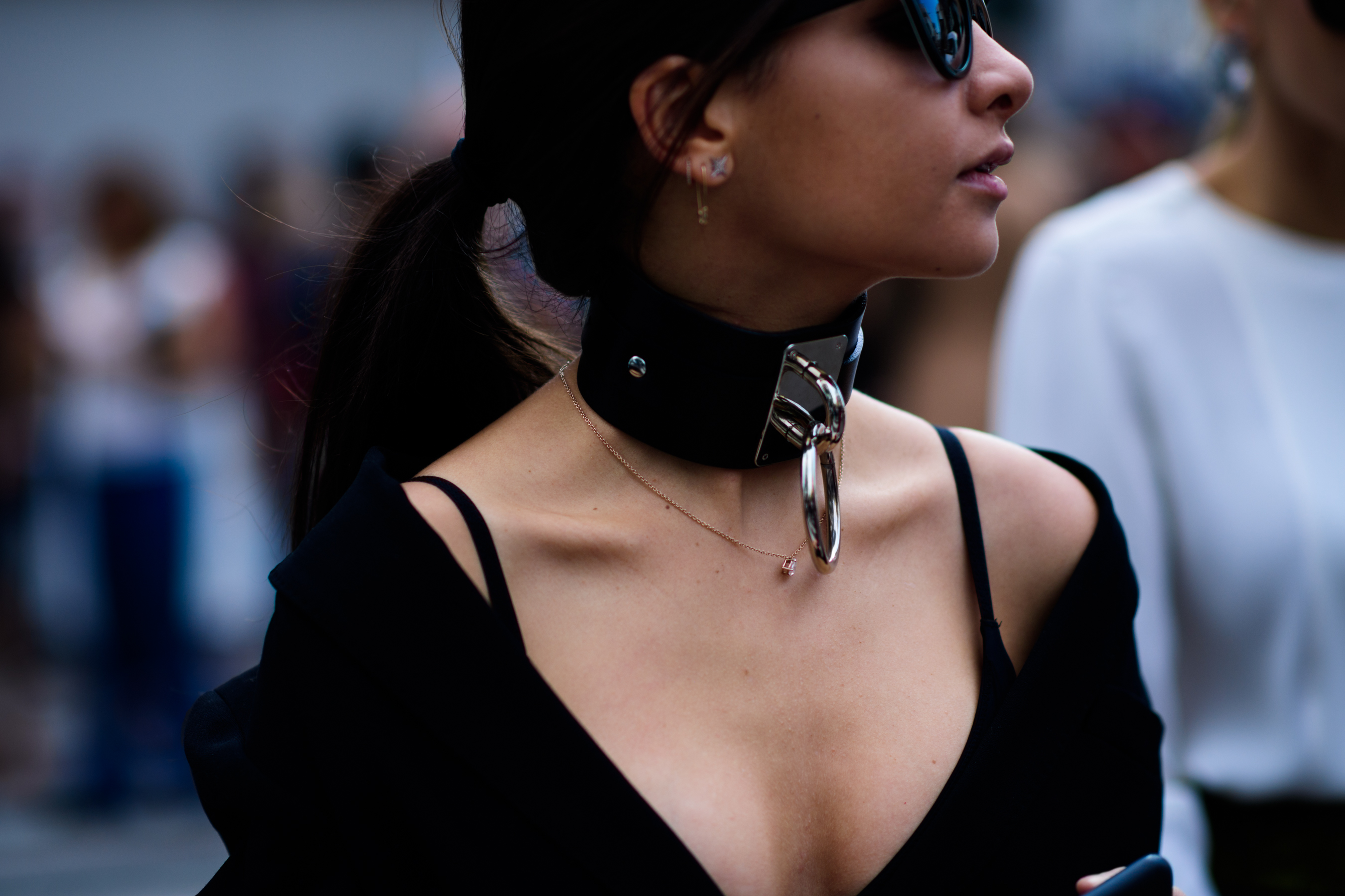 Woman wearing big choker