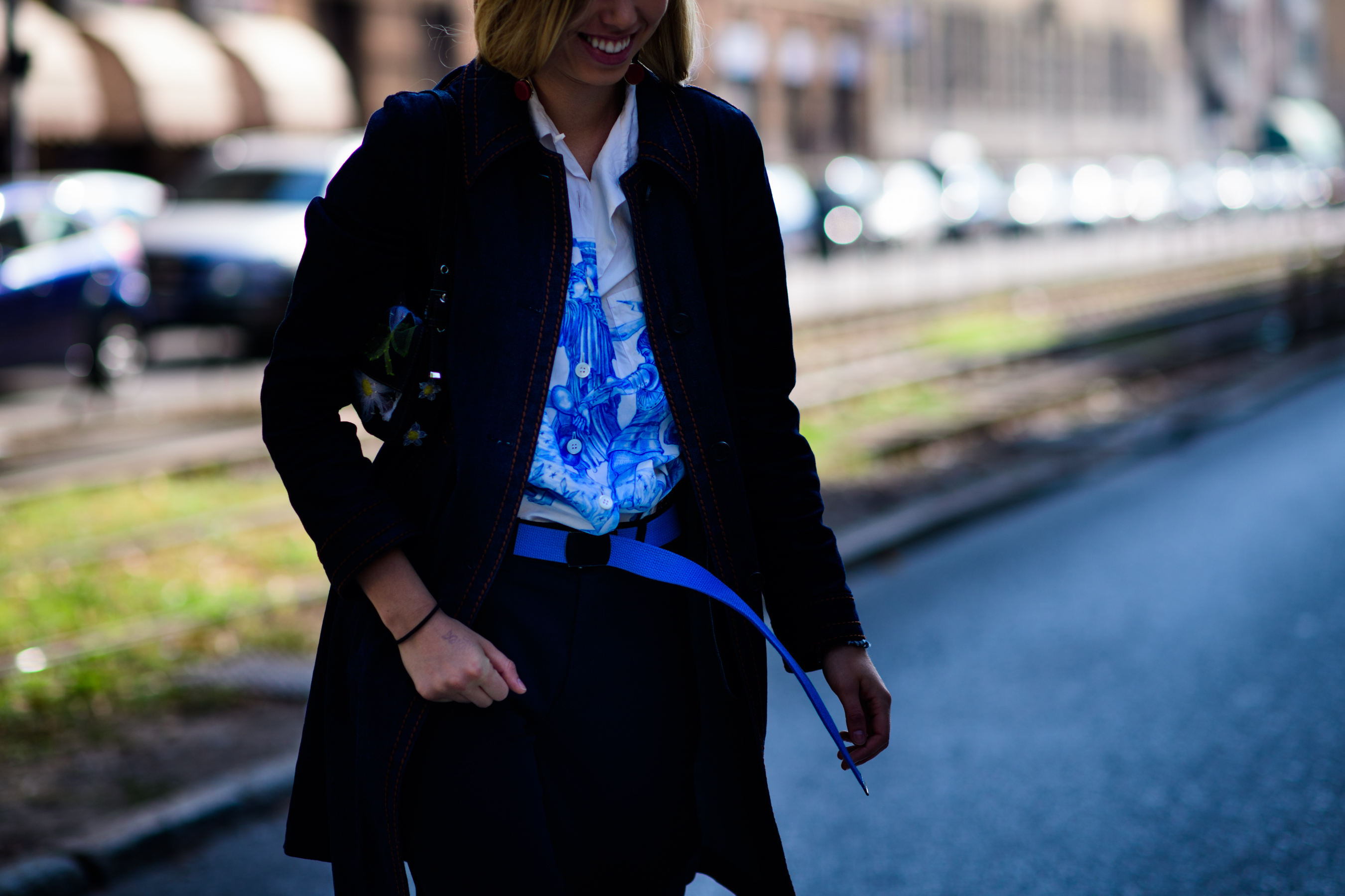 Woman wearing blue Prada shirt