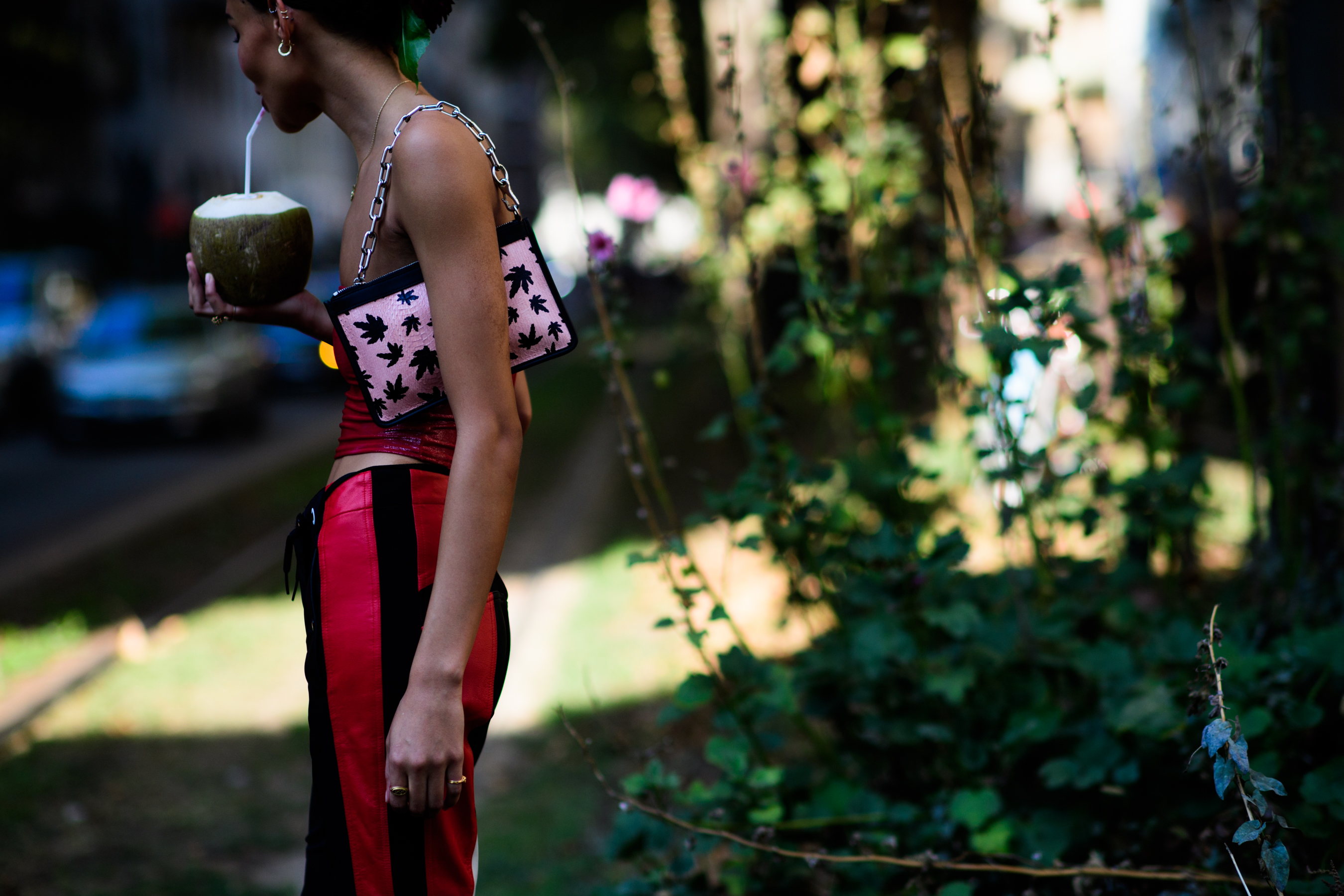 Model drinking coconut after Dolce & Gabbana