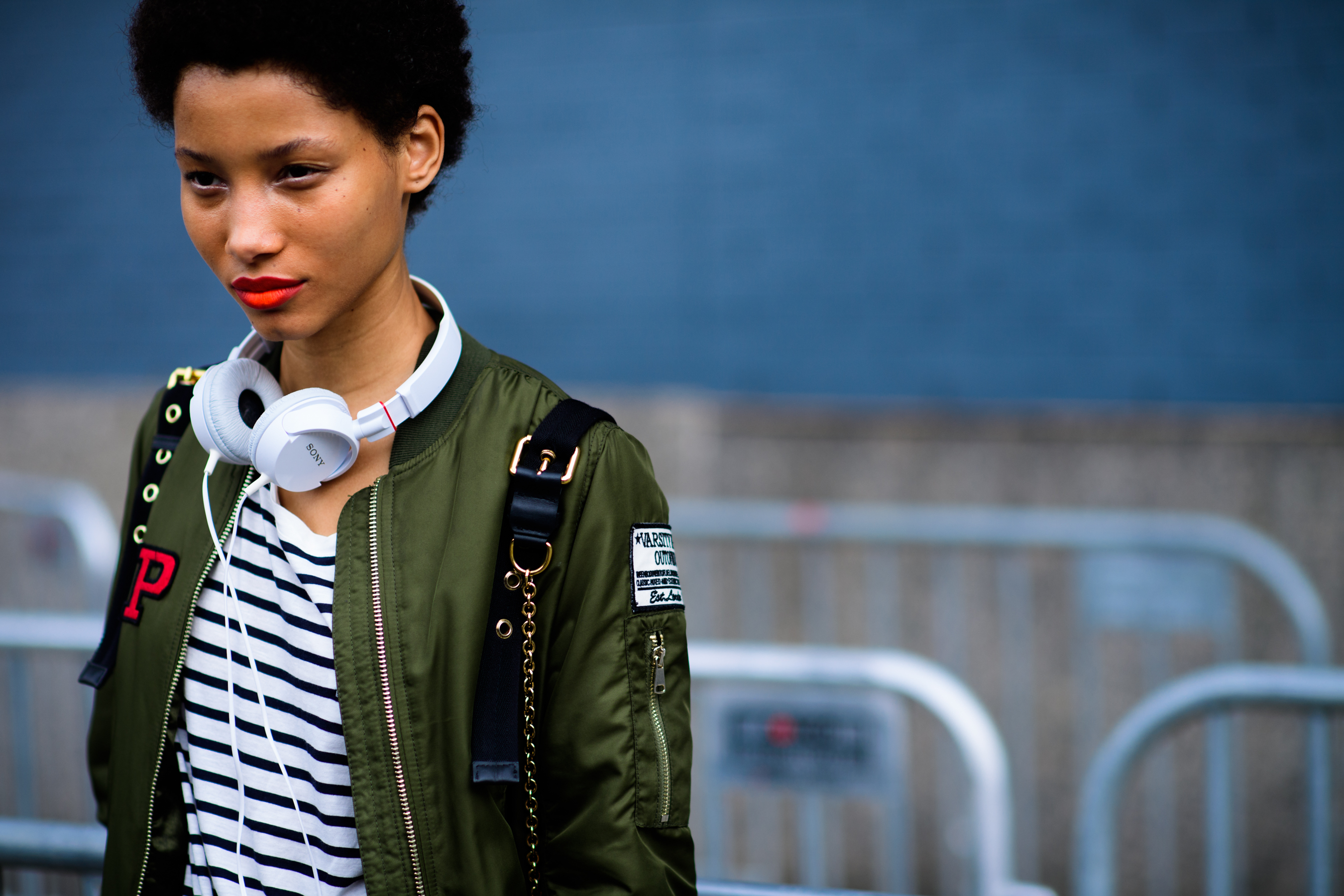 Dominican model wearing green bomber