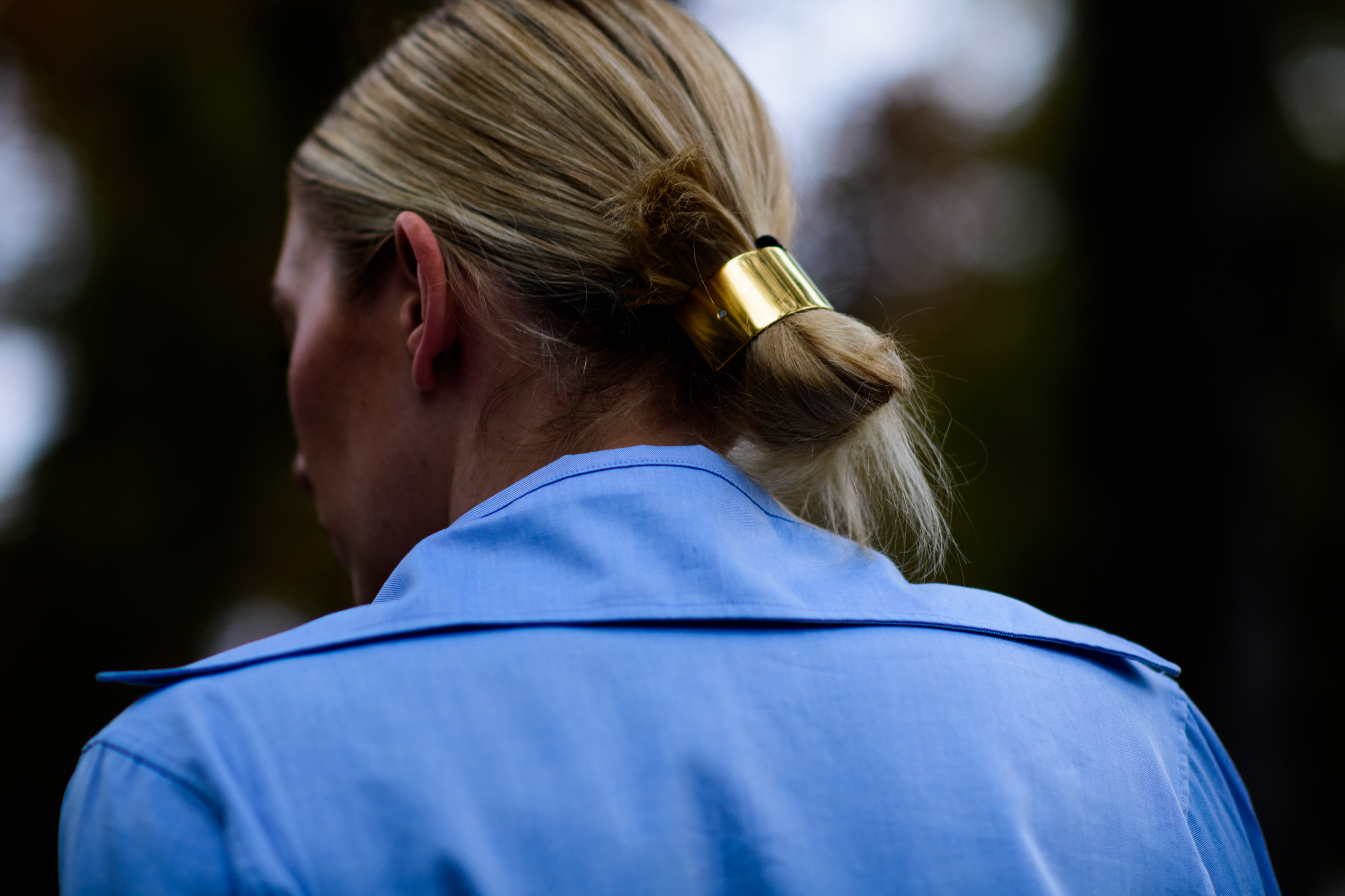 Woman wearing golden hair tie