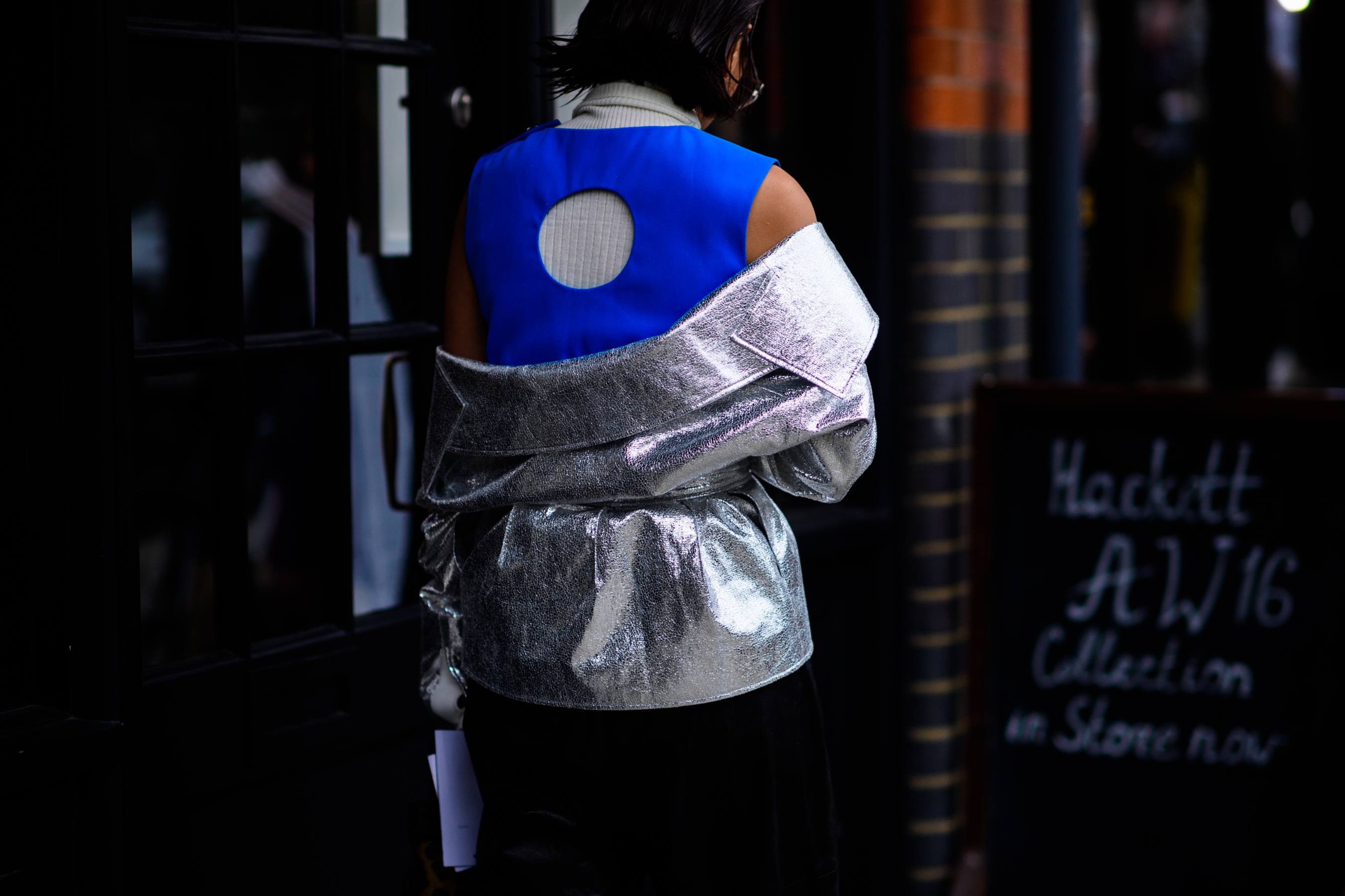 Woman wearing silver jacket