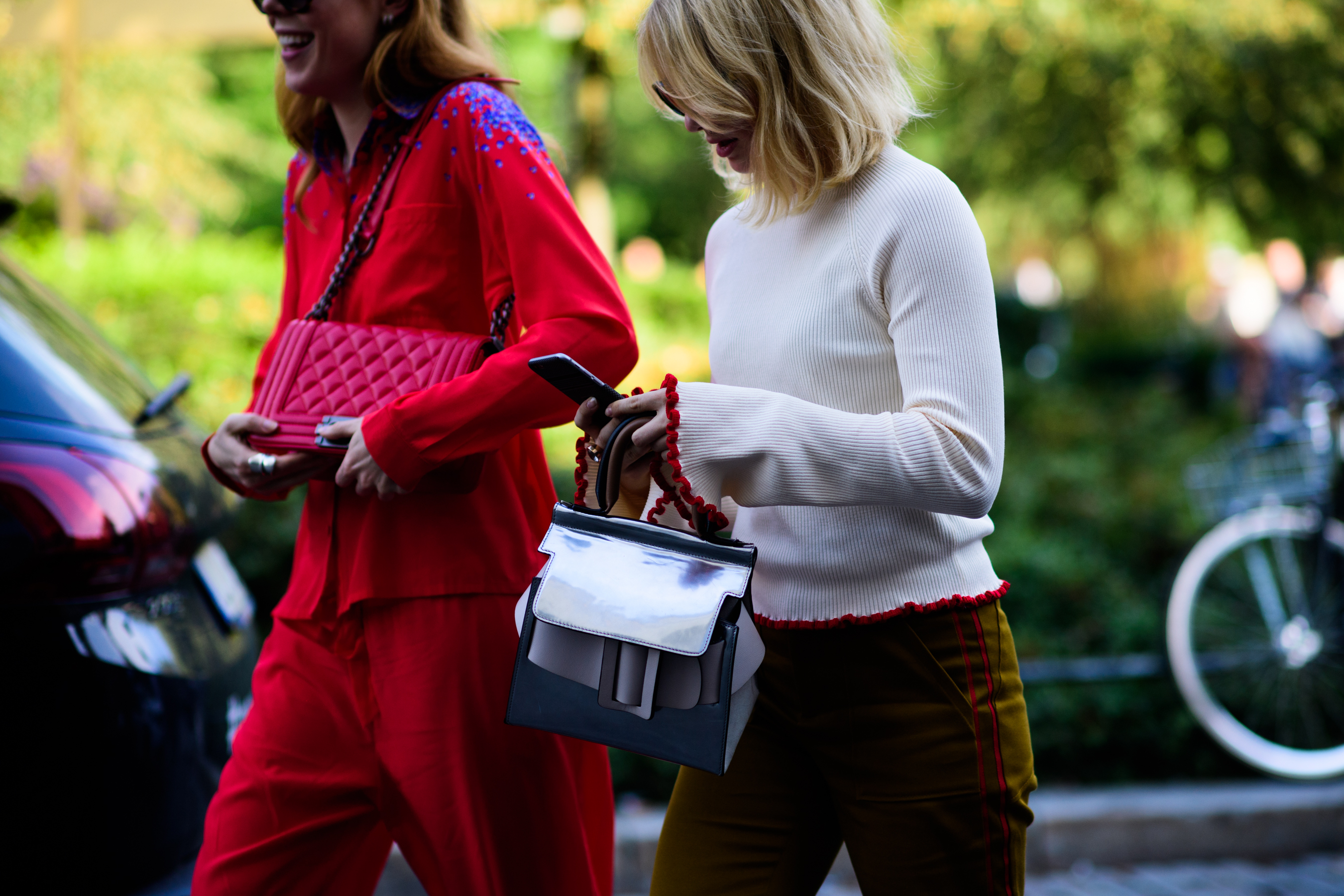 Two women with hand bags