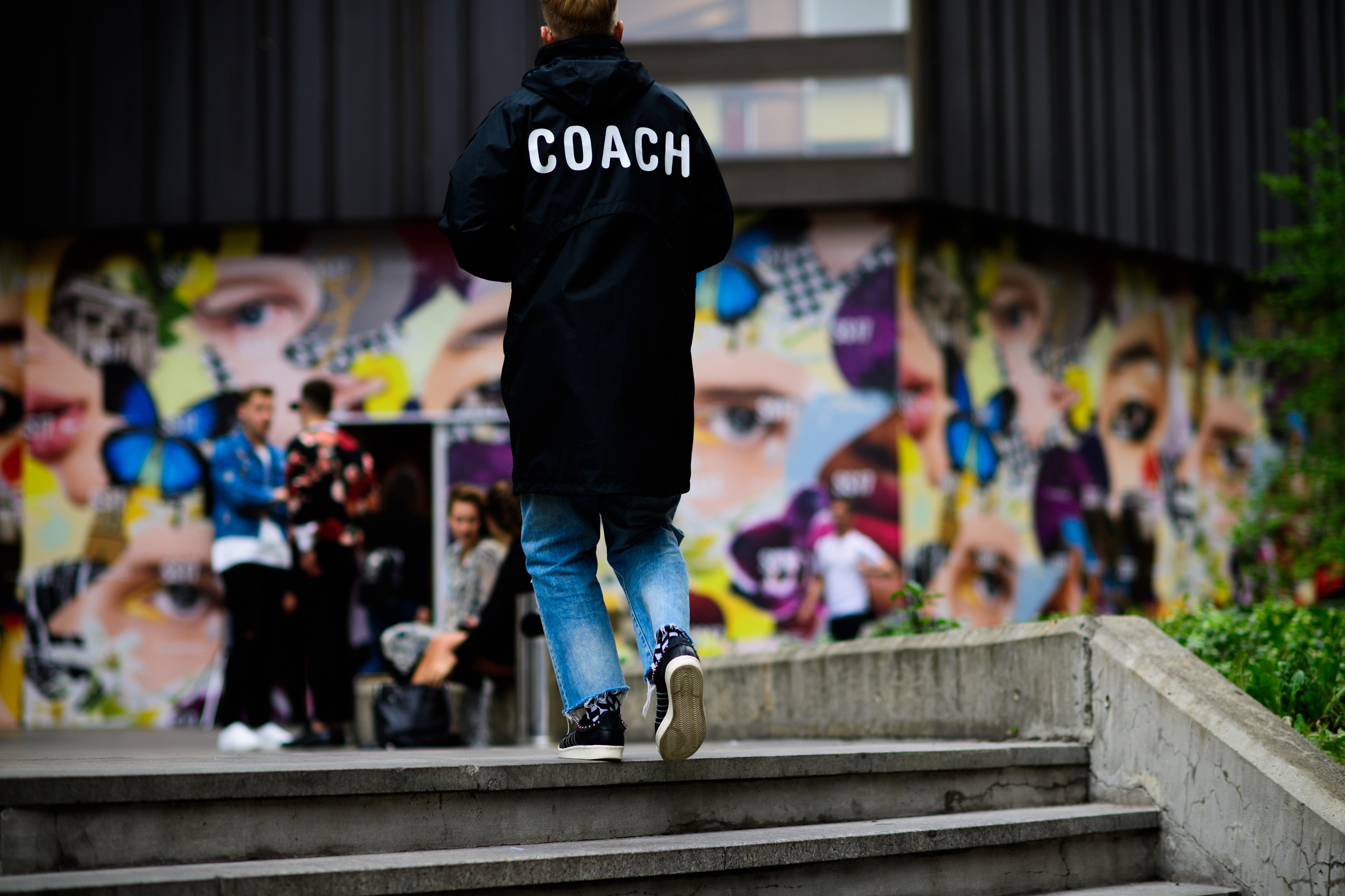 Man wearing Coach rain jacket