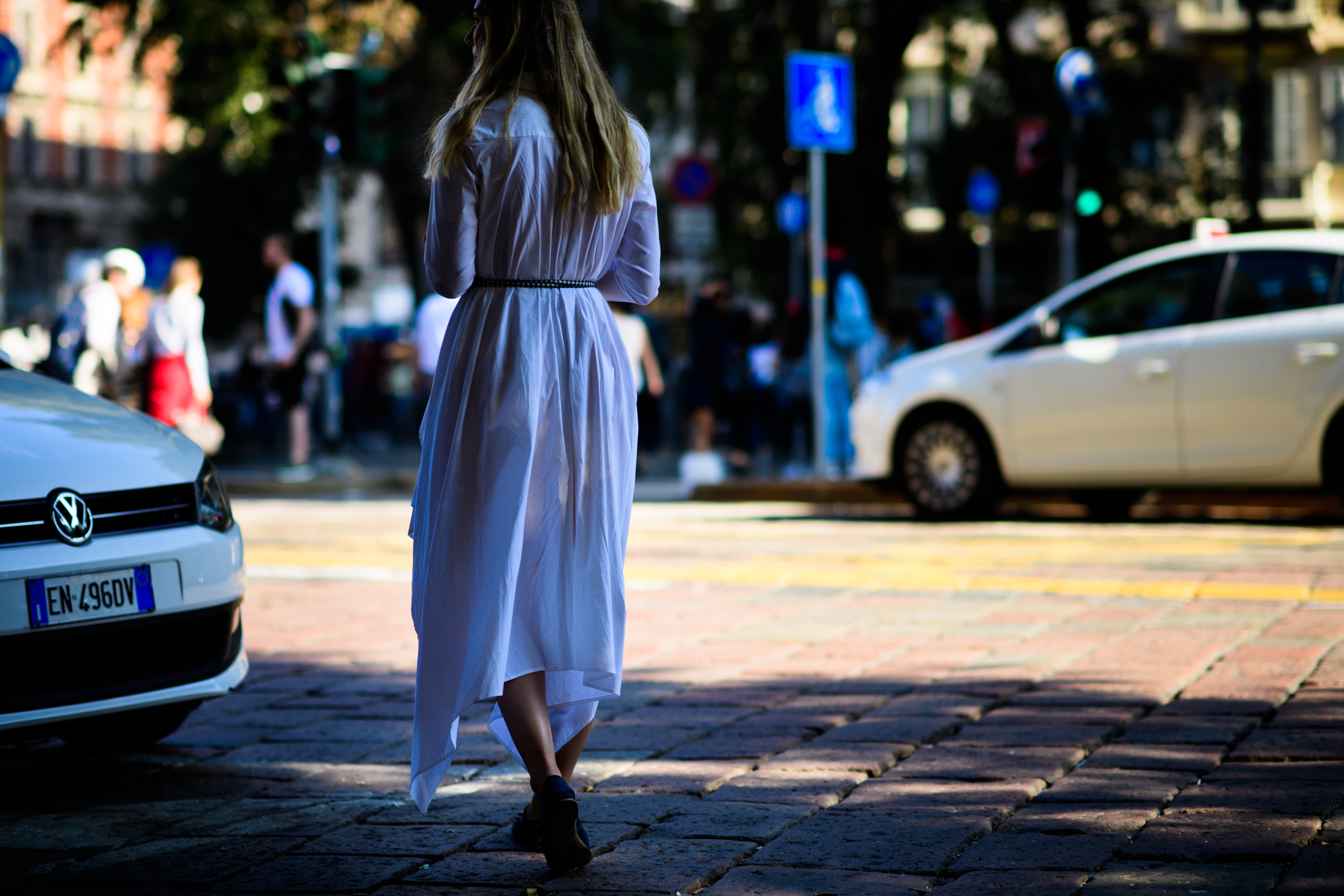 Woman wearing white shirt dress
