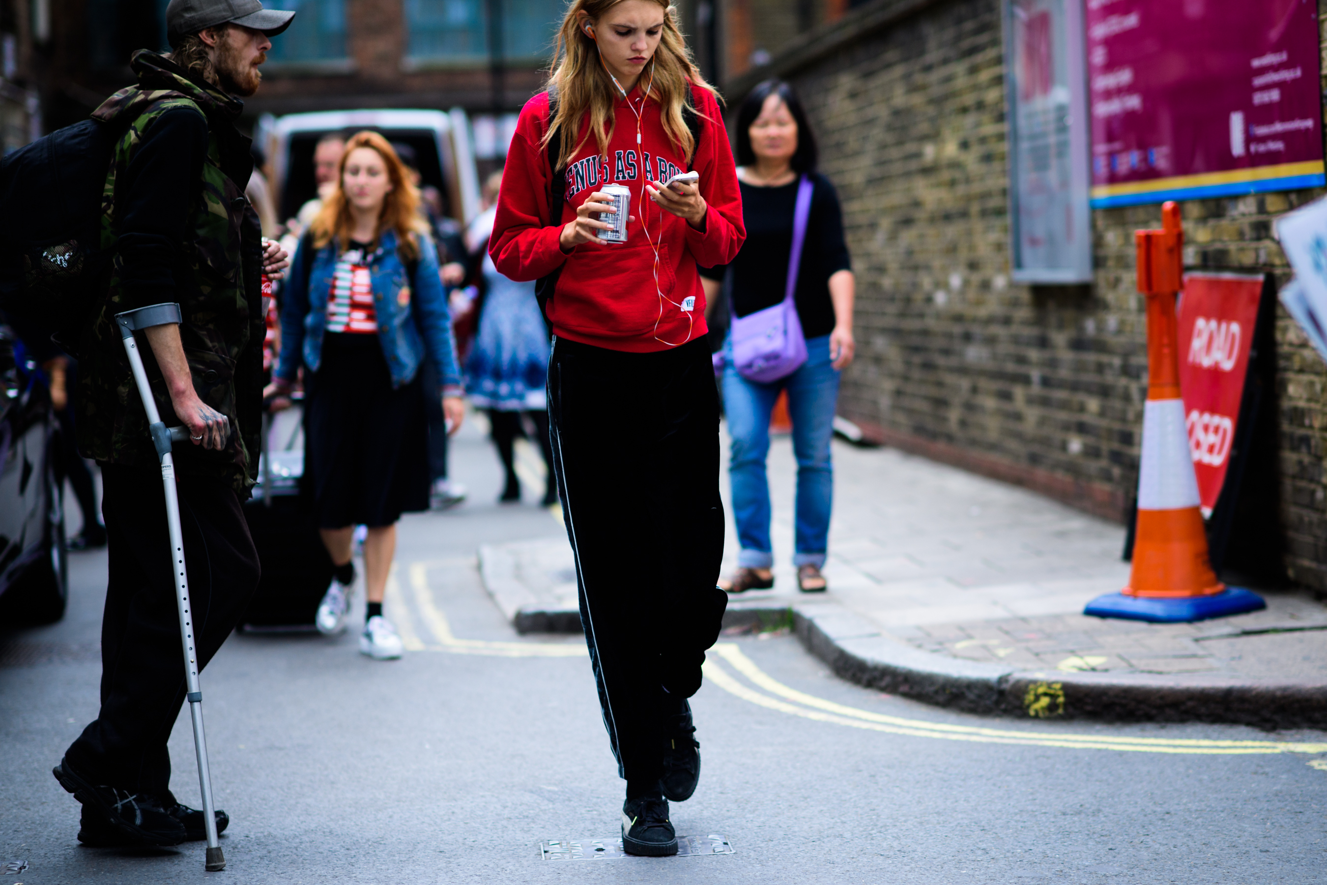 Model wearing red hoodie