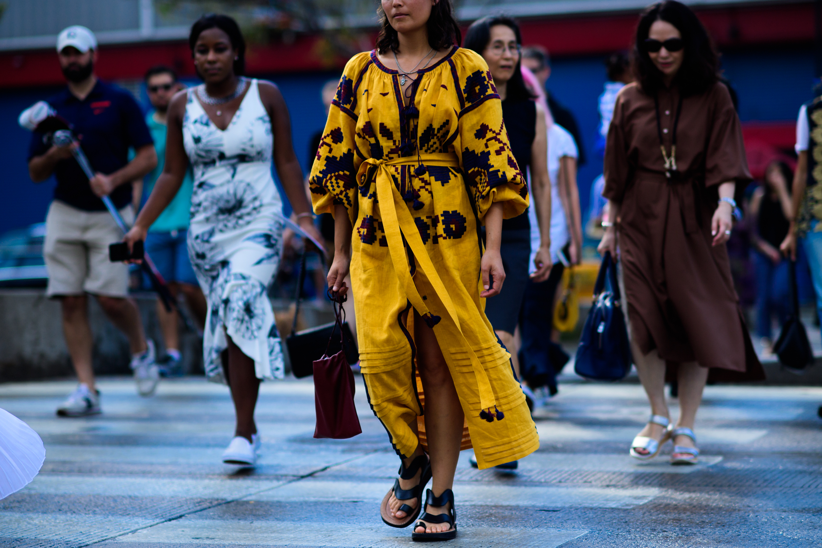 Woman wearing yellow Vita Kin dress