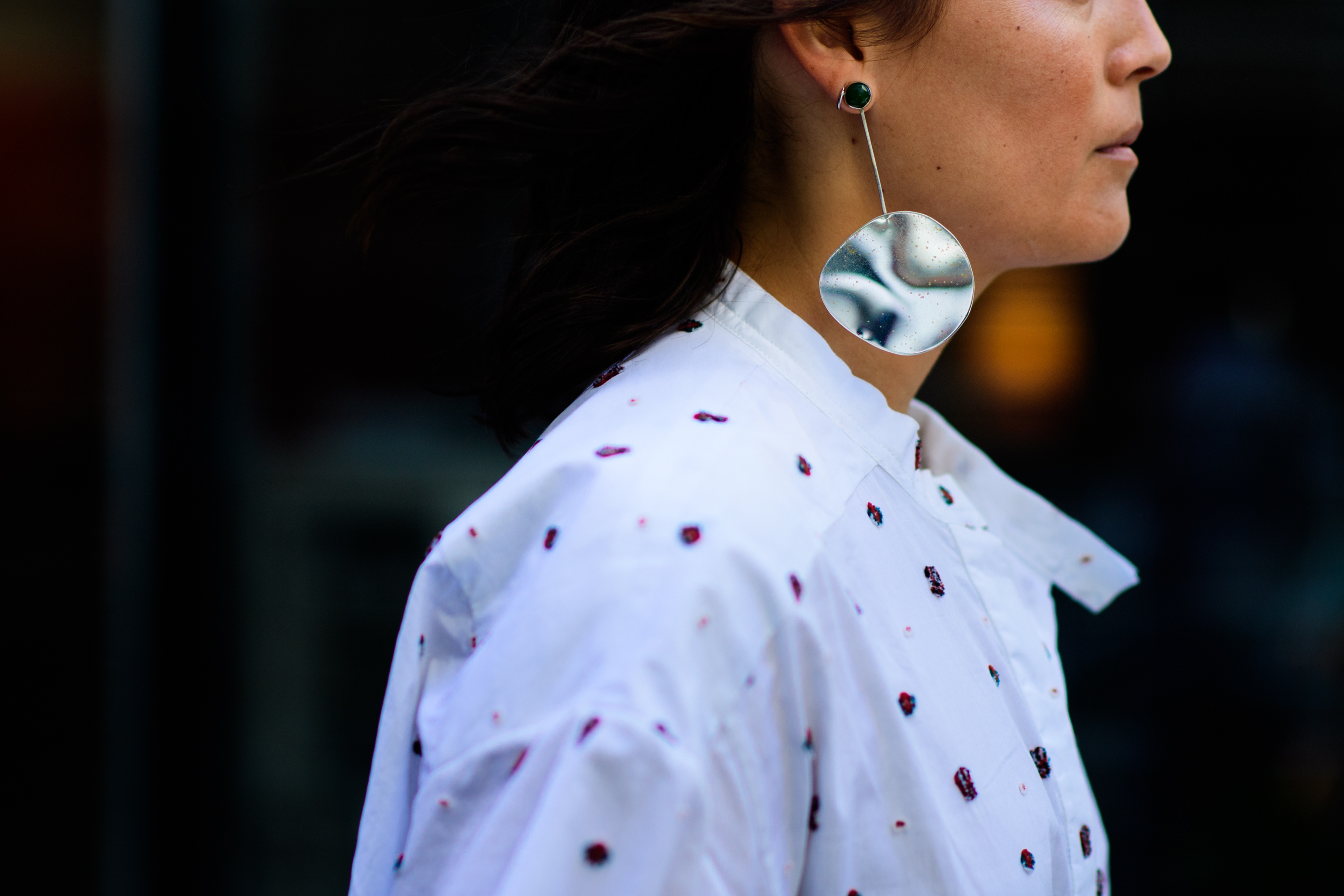 Journalist wearing raw silver earring