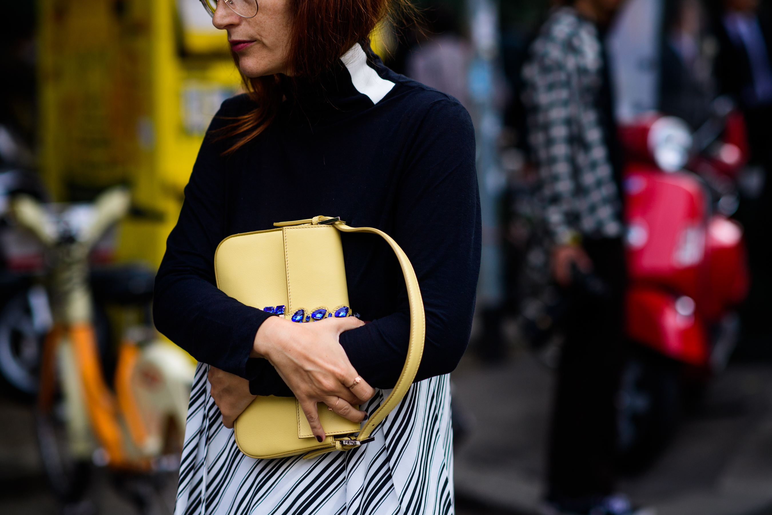 Woman with yellow hand bag