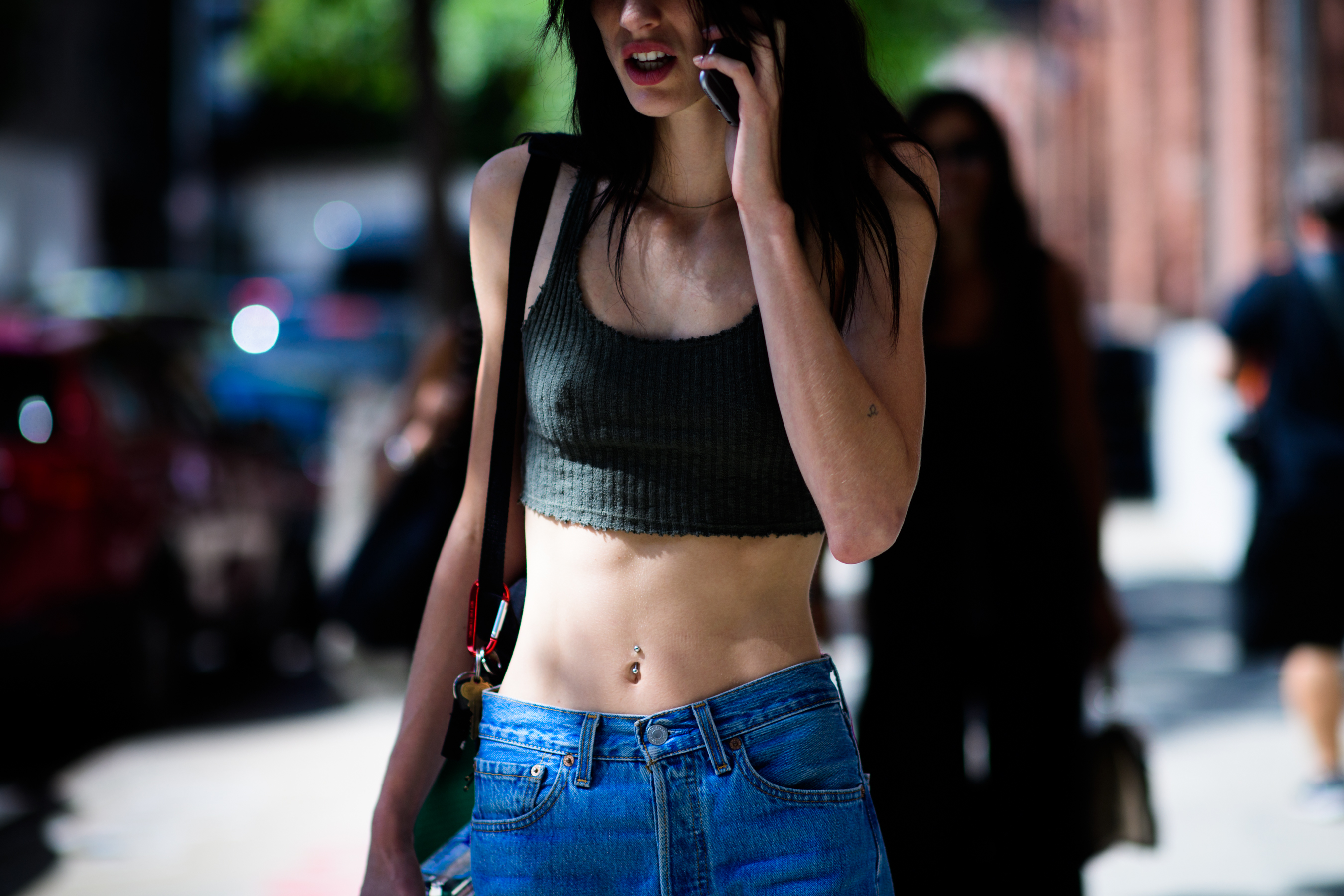 American model wearing short top