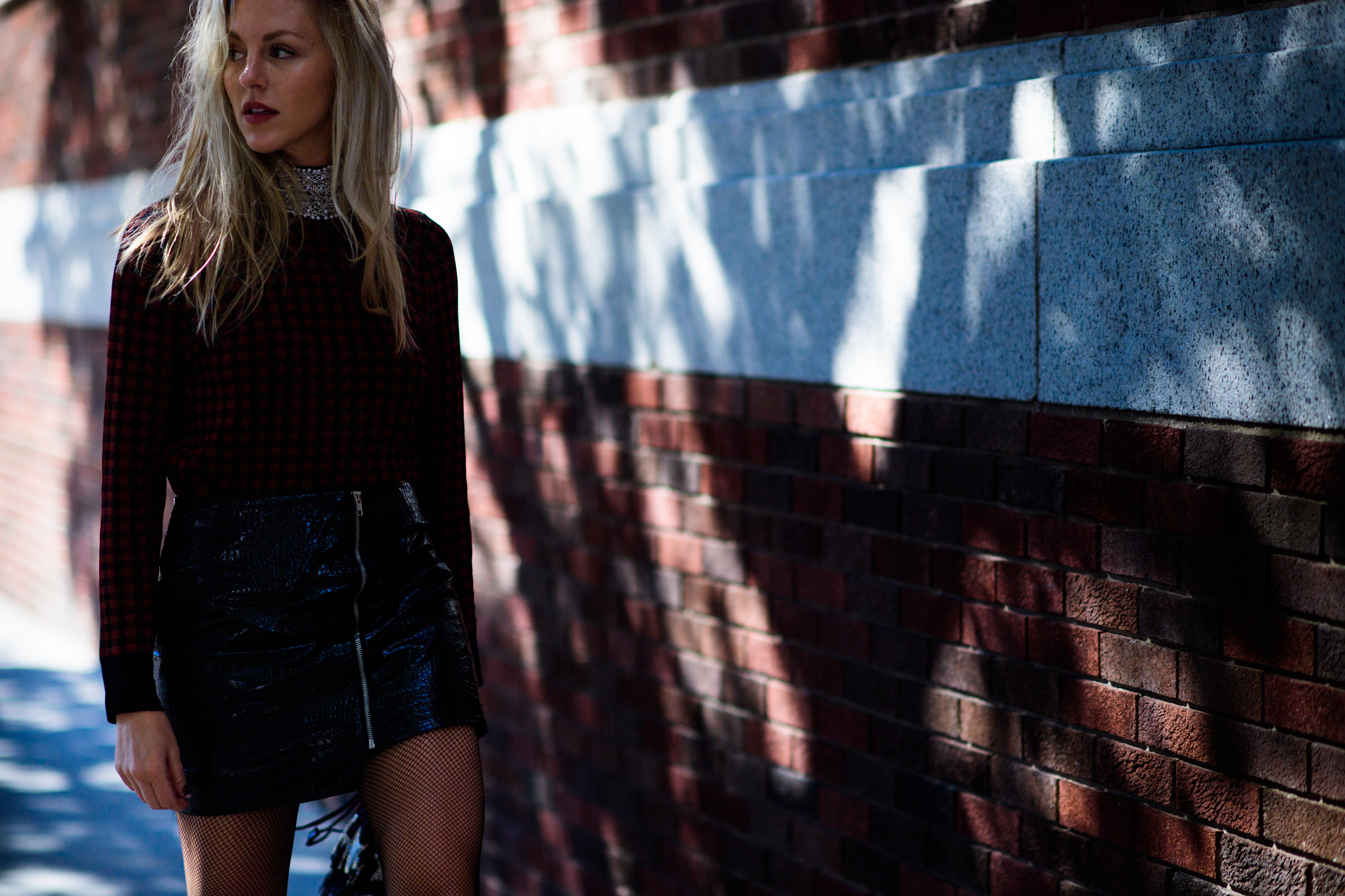 American blogger wearing mini skirt