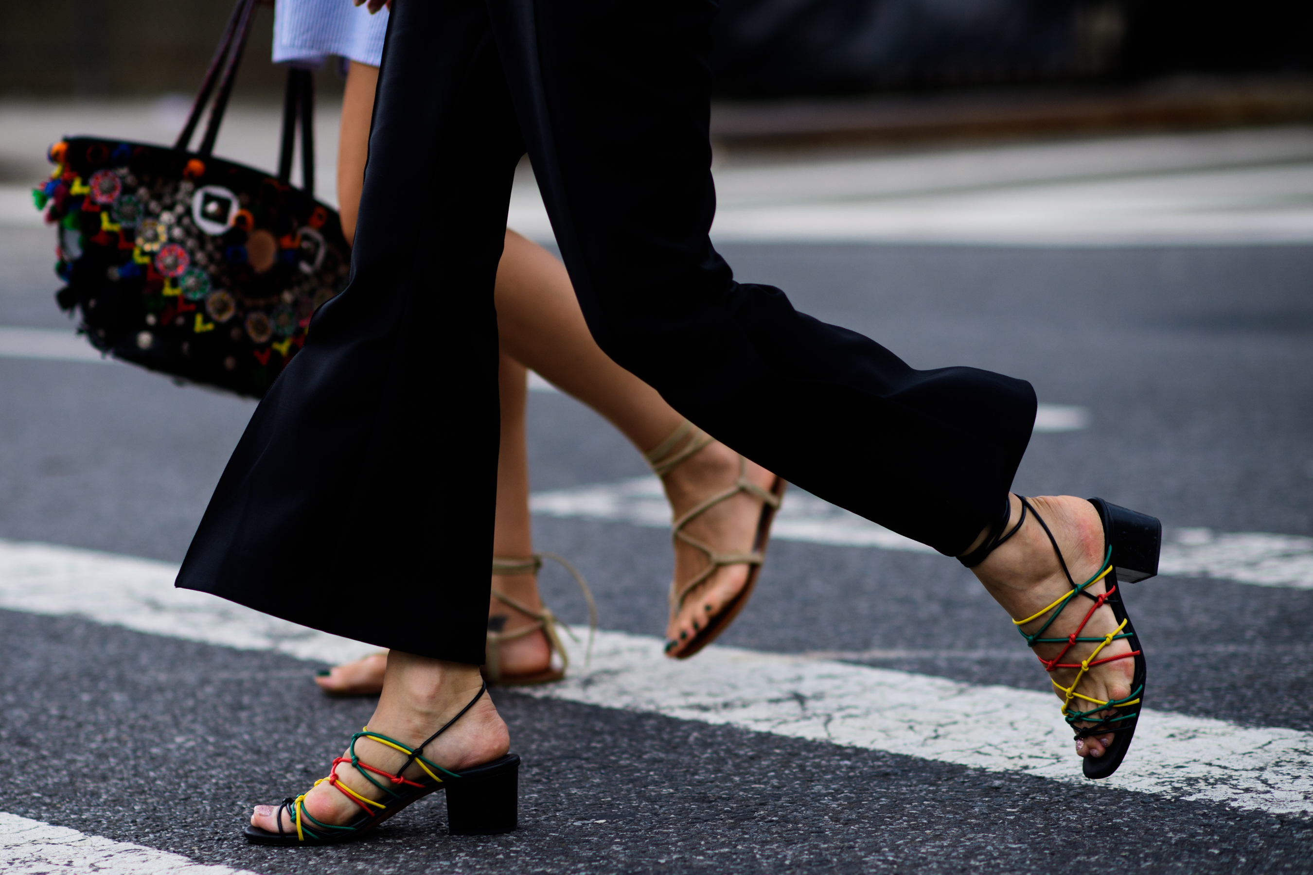 Woman wearing colourful sandal shoes