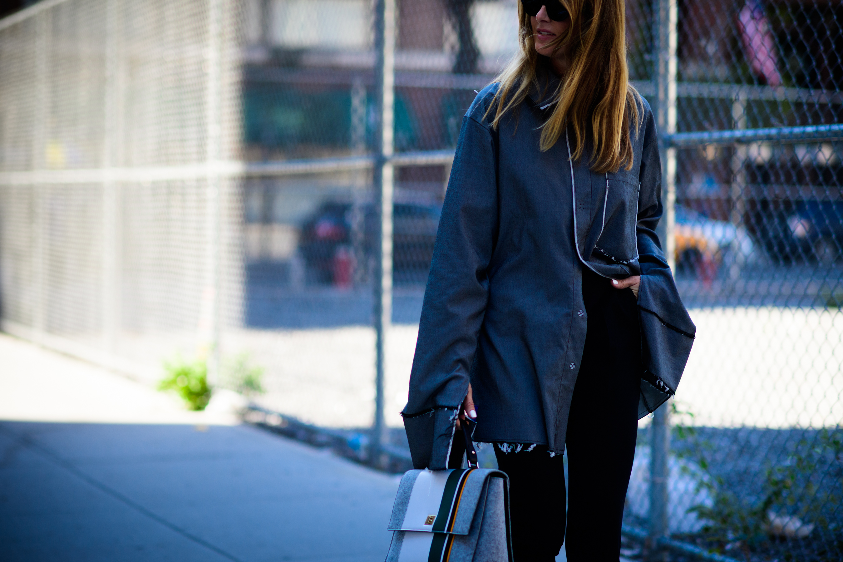Woman wearing grey oversized shirt