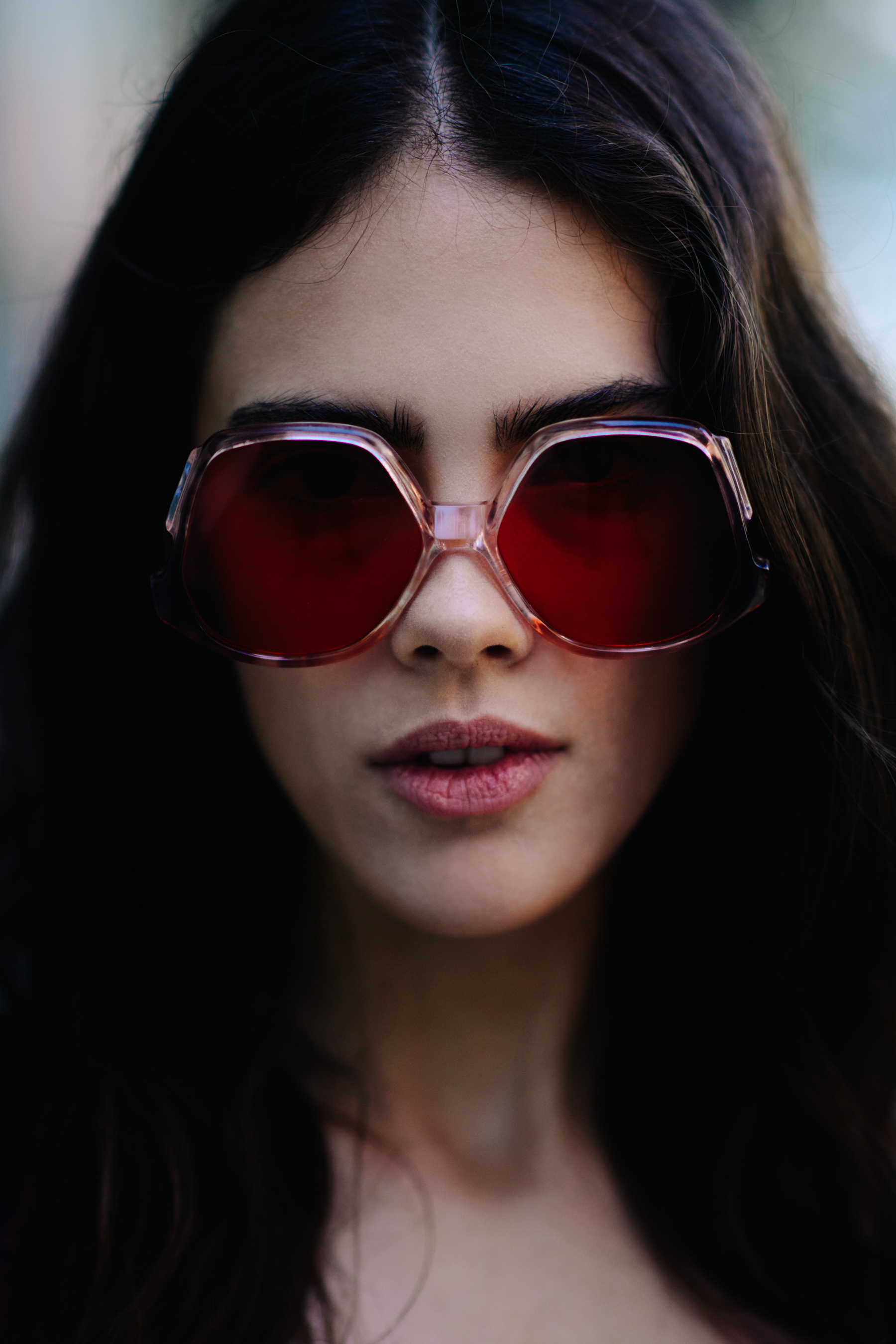 Portrait of a model wearing red glasses